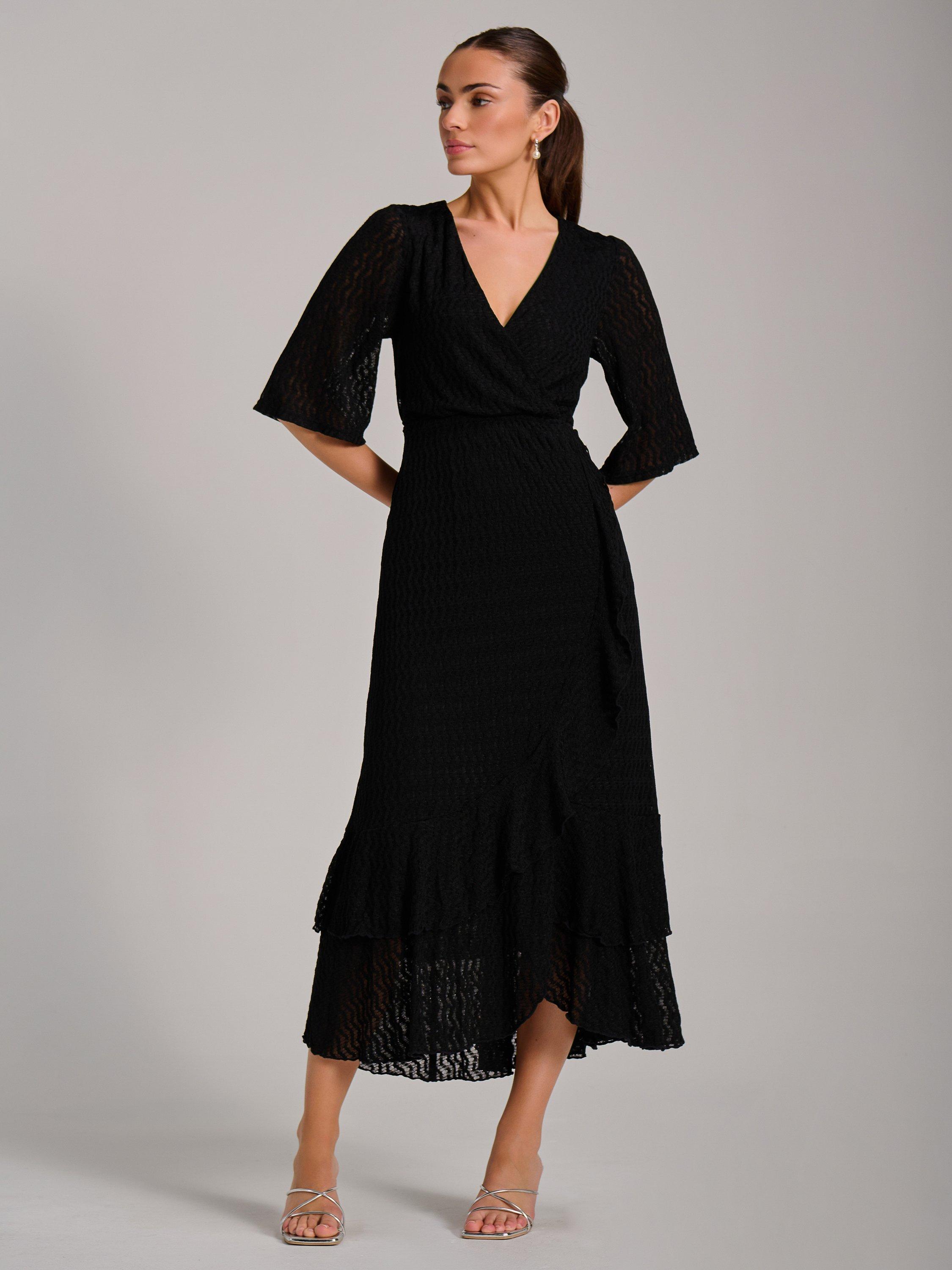Product image 6 of 7, which shows Jolie Moi Ruffle Hem Knitted Maxi Dress, Black, 8