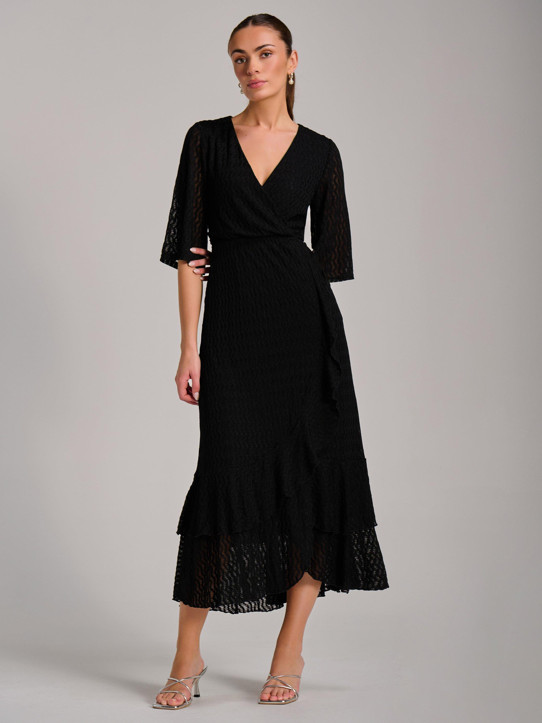Product image 7 of 7, which shows Jolie Moi Ruffle Hem Knitted Maxi Dress, Black, 8