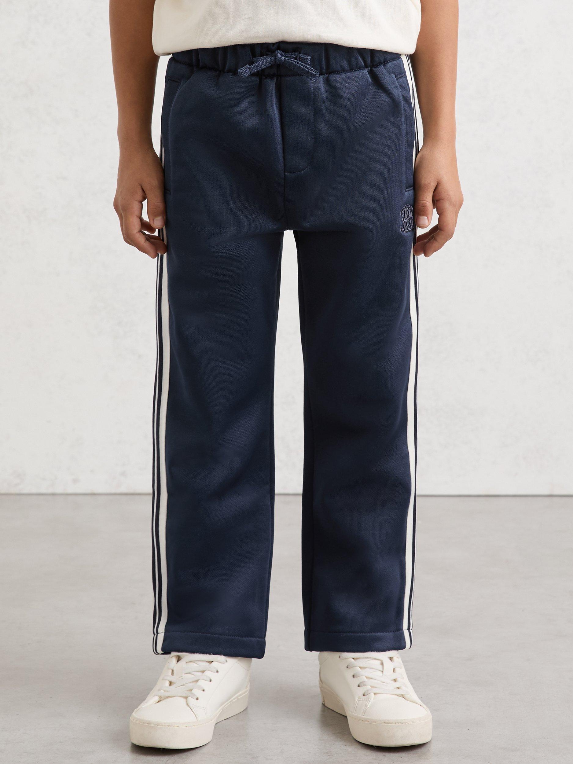 Product image 1 of 5, which shows Reiss Kids' Foster Monogram Side Stripe Joggers, Navy Blue, 3-4 years