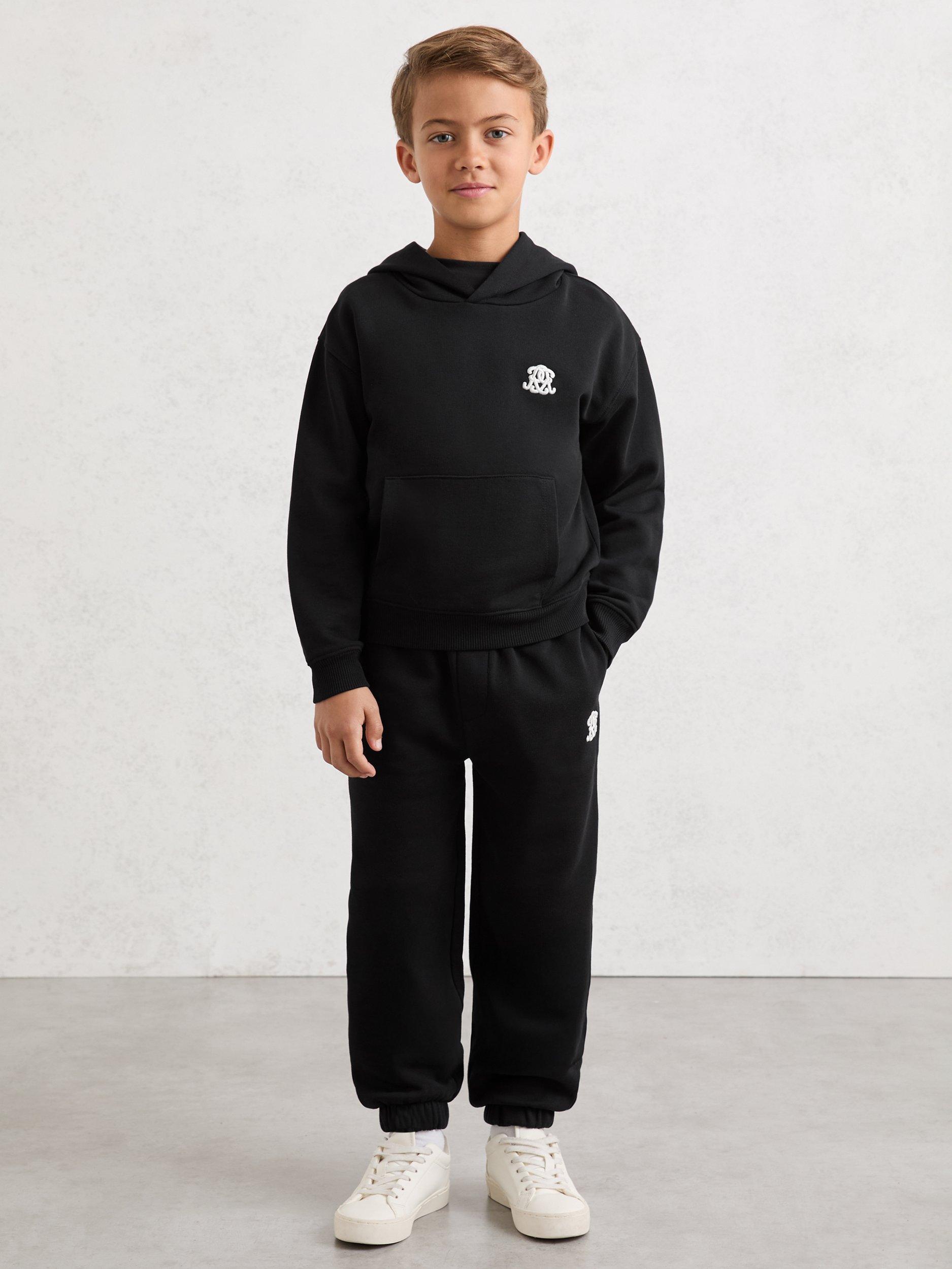 Product image 1 of 4, which shows Reiss Kids' Murlin Cotton Drawstring Joggers, Black, 3-4 years