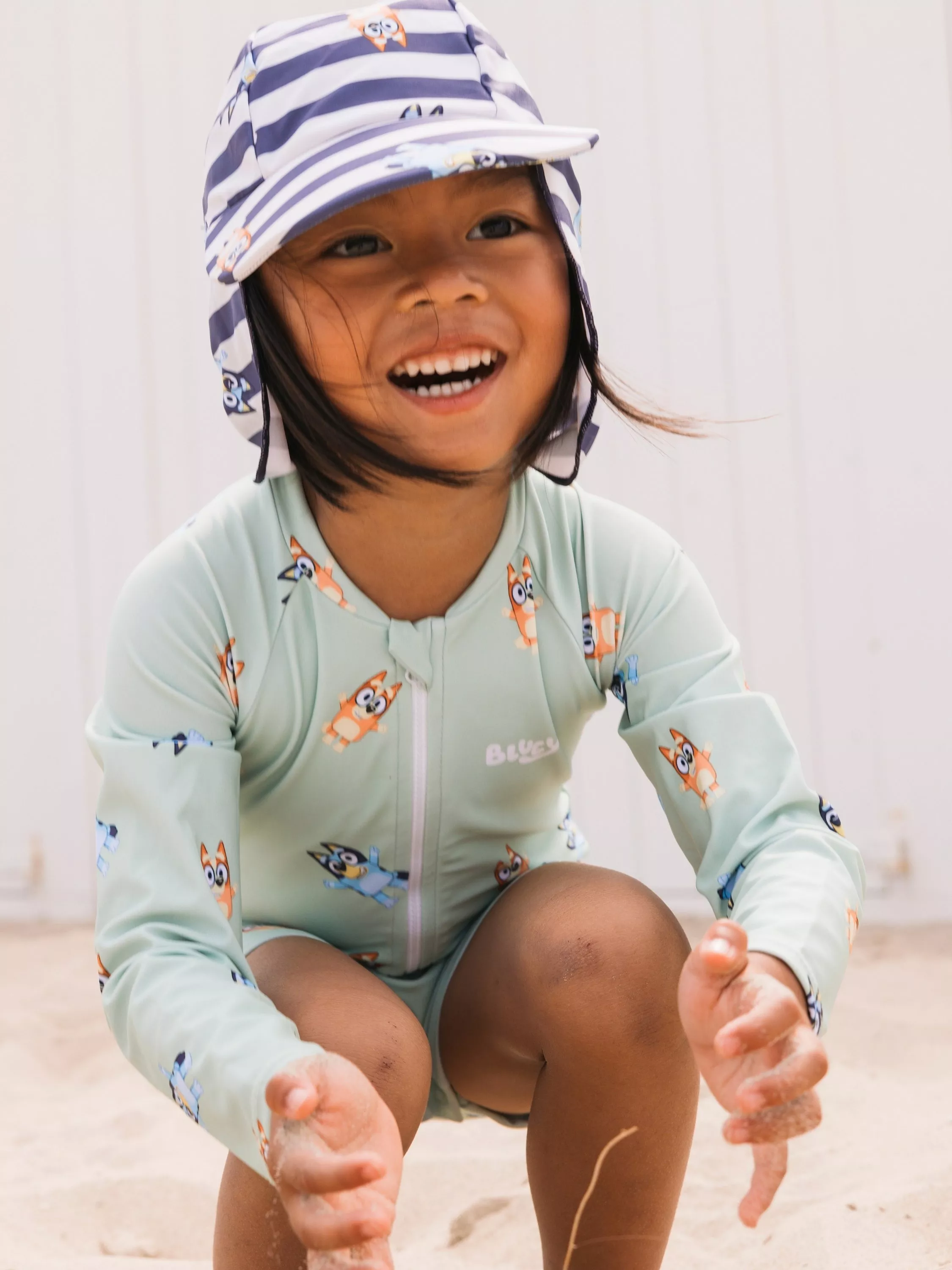 Young boy wearing a teddy bear onesie