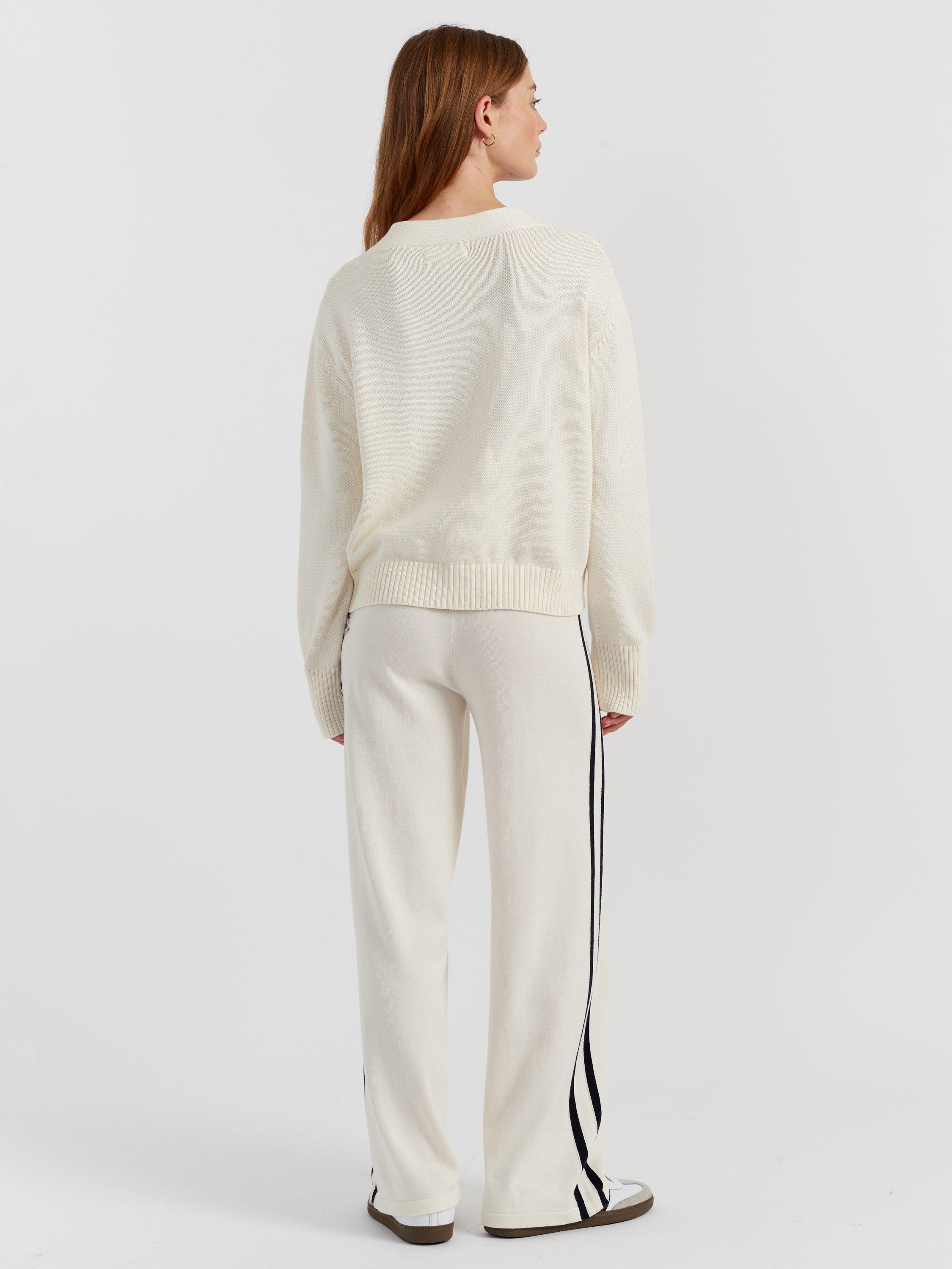 Product image 2 of 4, which shows Chinti & Parker Snoopy Varsity Cardigan, Cream, XS