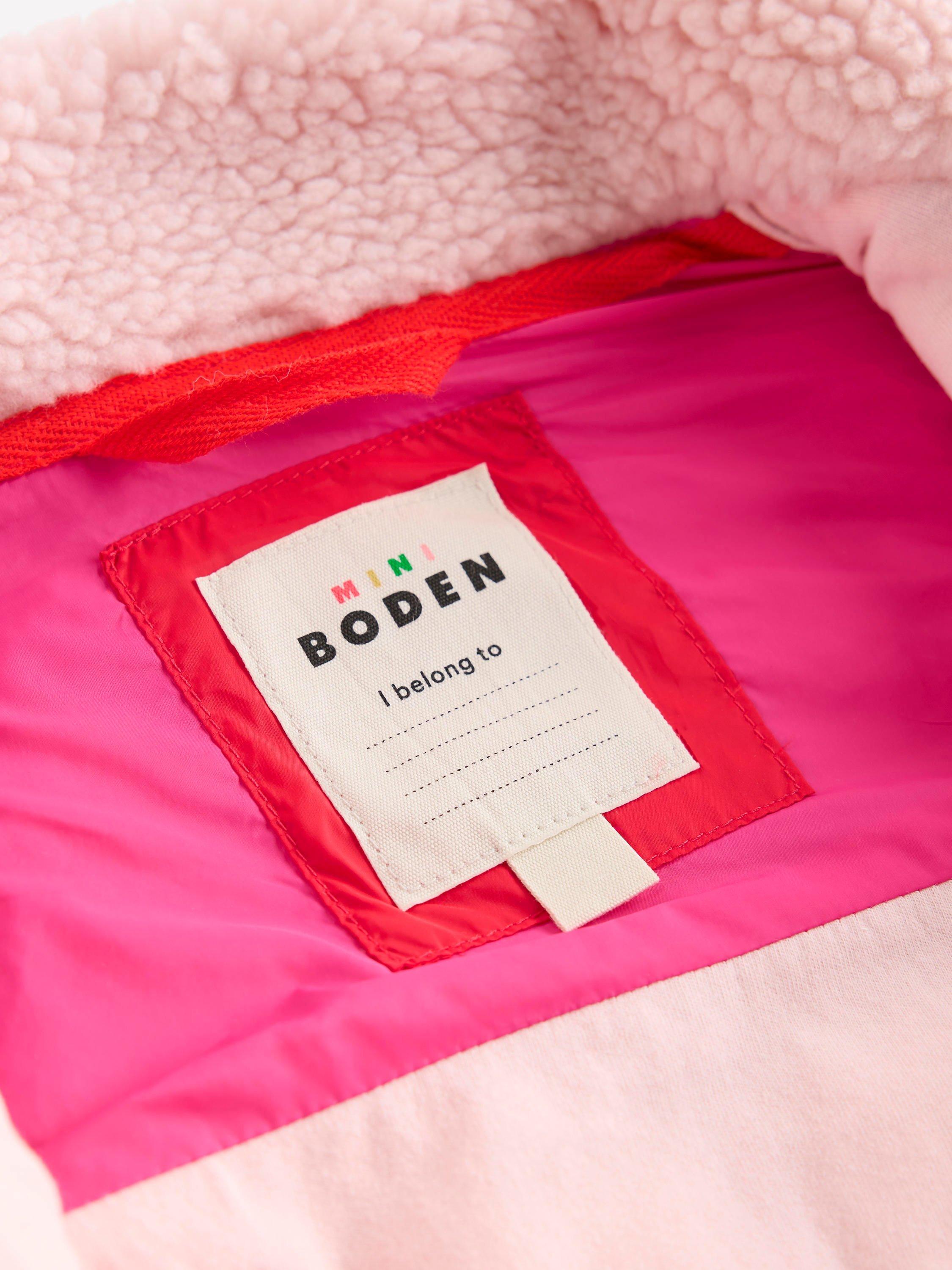 Product image 4 of 5, which shows Mini Boden Kids' 2-in-1 Quilted Borg Sleeve Jacket, Pink/Multi, 2-3 years