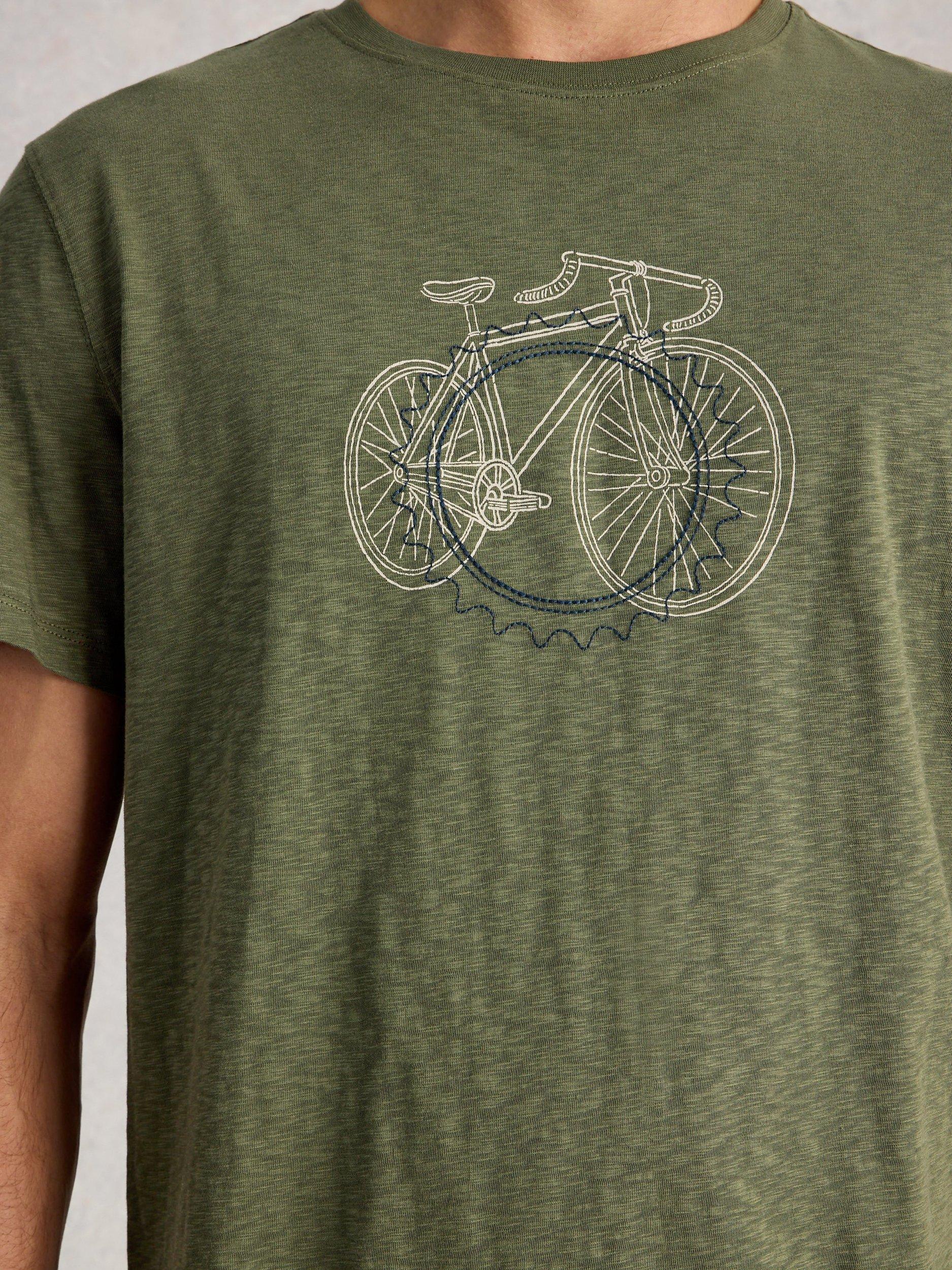 Product image 3 of 6, which shows White Stuff Abersoch Cotton Regular Fit Cogs Graphic T-Shirt, Mid Green, S Reg