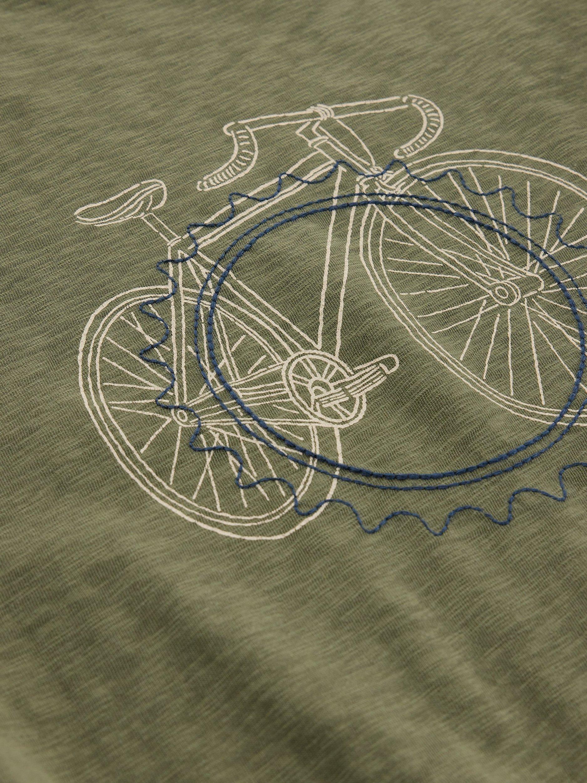Product image 6 of 6, which shows White Stuff Abersoch Cotton Regular Fit Cogs Graphic T-Shirt, Mid Green, S Reg