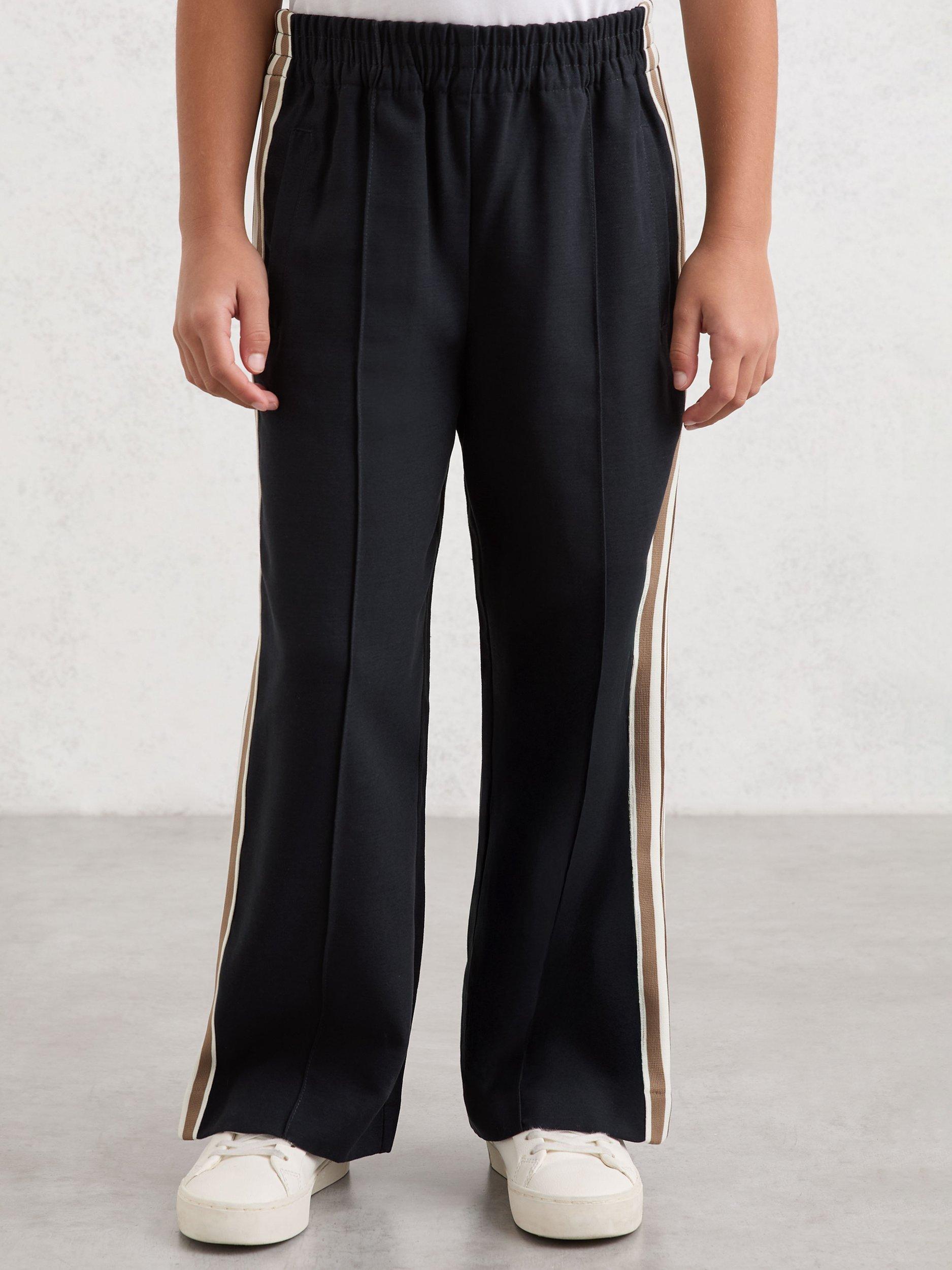 Product image 1 of 6, which shows Reiss Kids' Robyn Side Stripe Trousers, Navy, 3-4 years