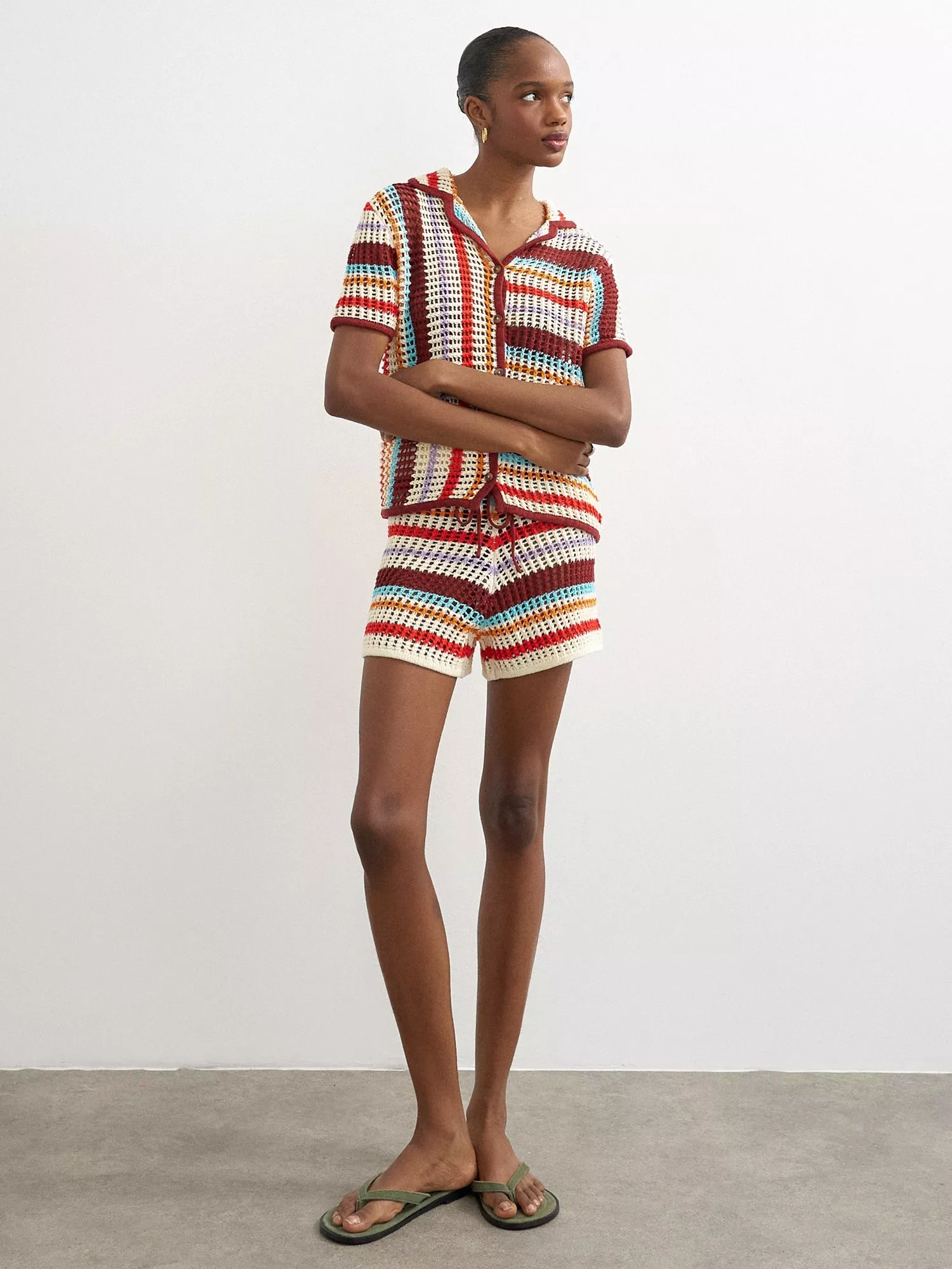 Model wearing multicoloured crochet knit top and matching shorts