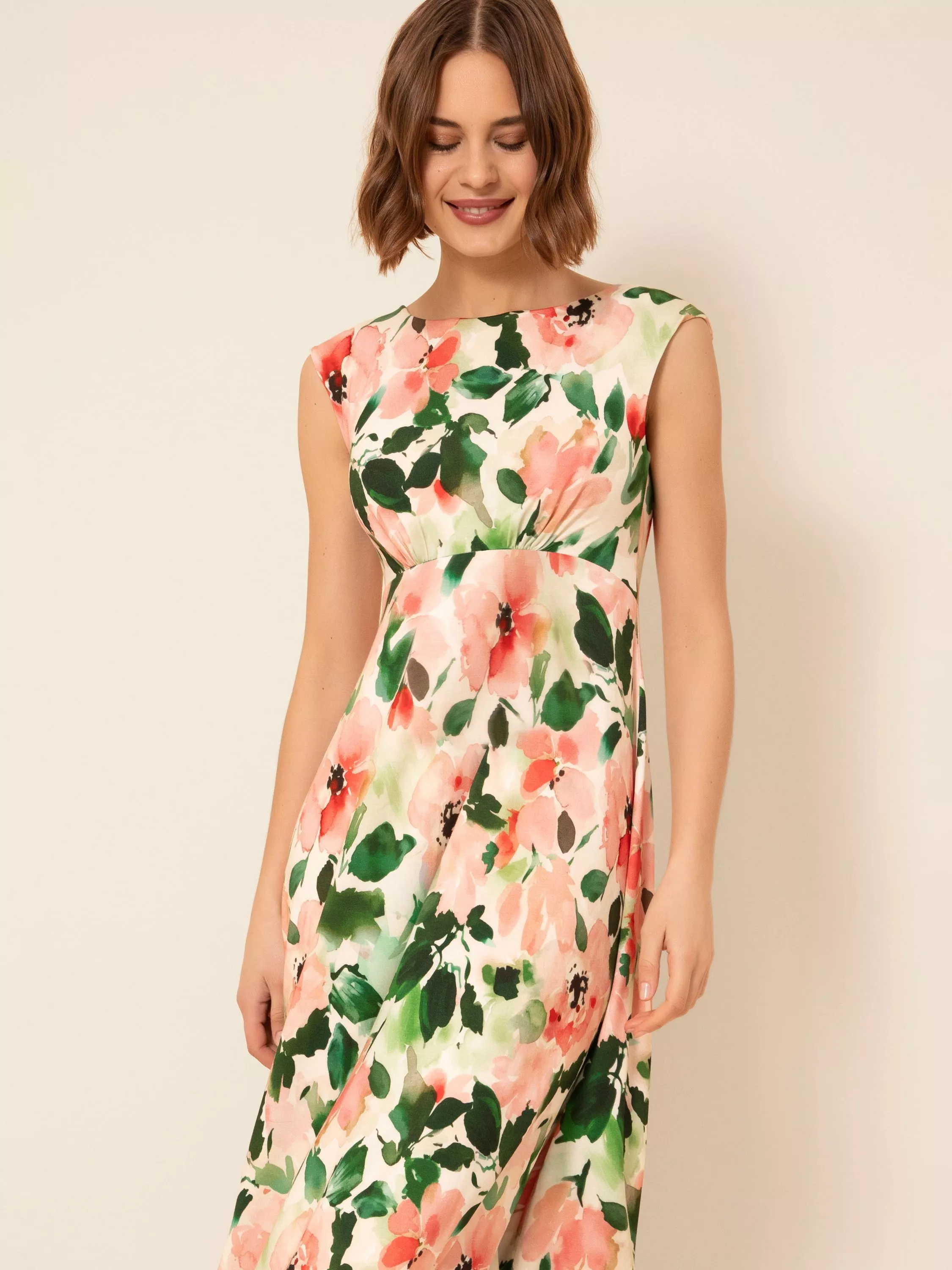 woman in brown ruched maxi dress with silver bangle