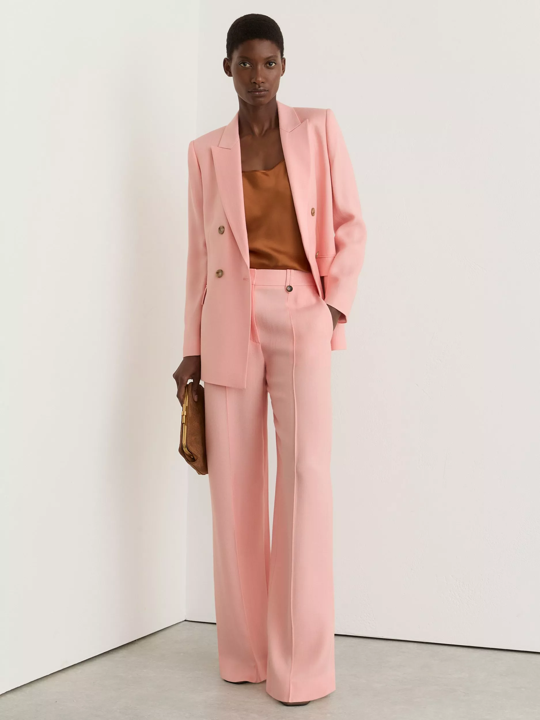 Woman wearing green shirred peplum top