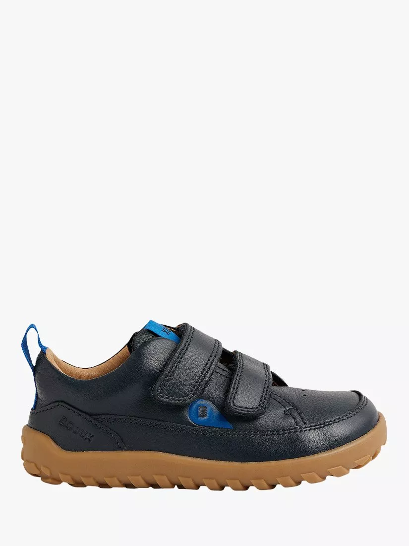 Navy leather kids’ trainer with double Velcro straps, blue accents and durable gum sole, side view on white.