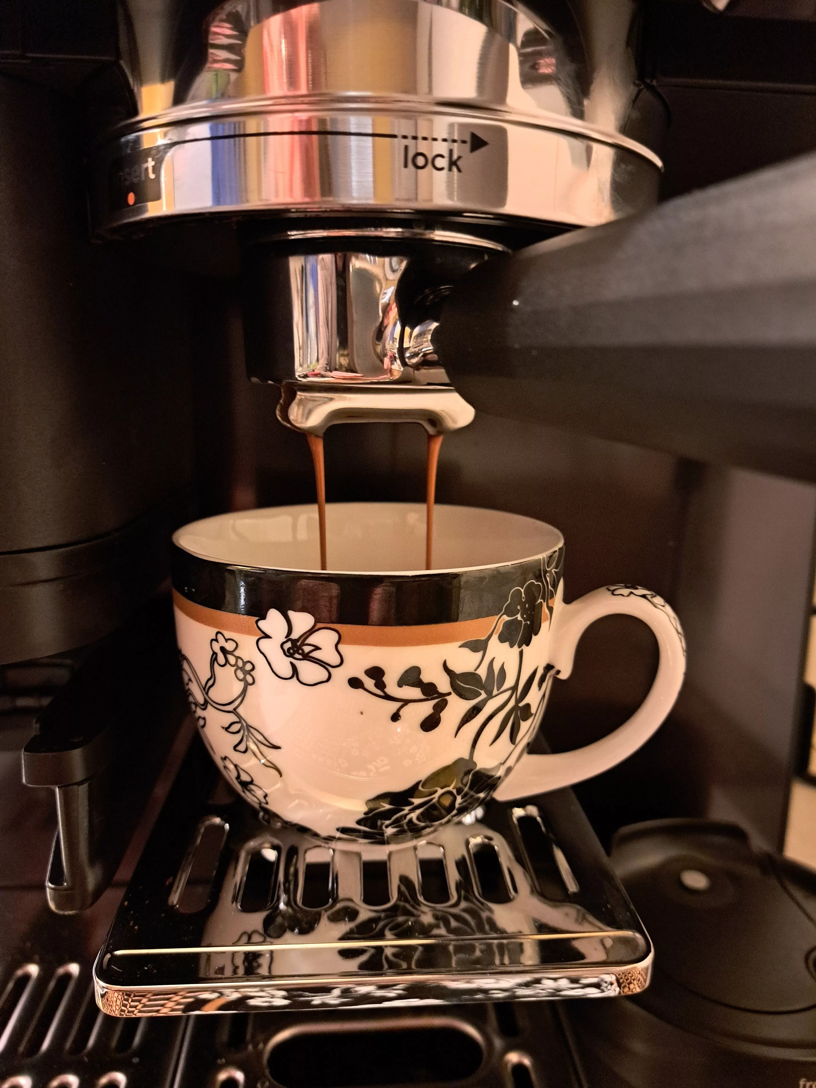 close up of a mil being poured into a coffee