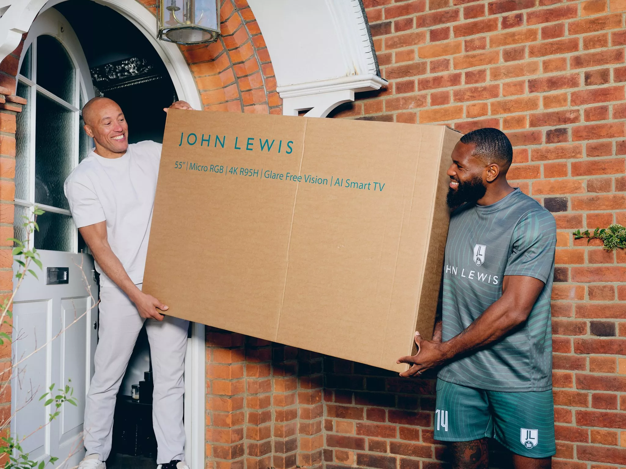 lenell carrying a TV