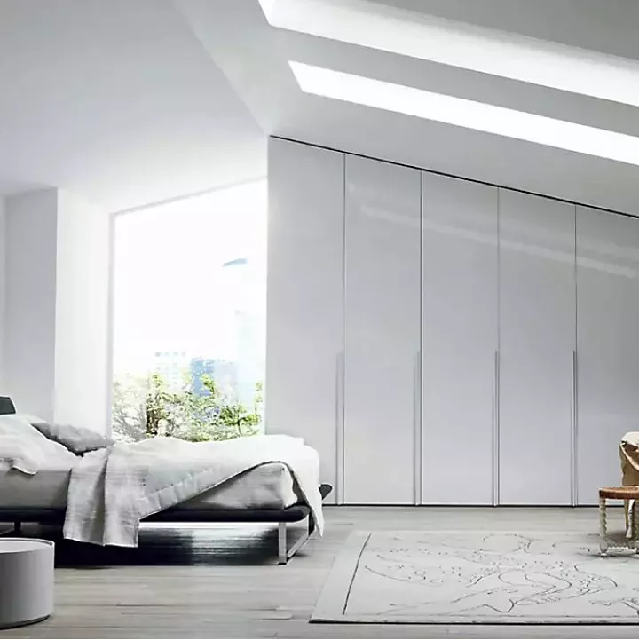 Bedroom with grey fitted wardrobes along the wall