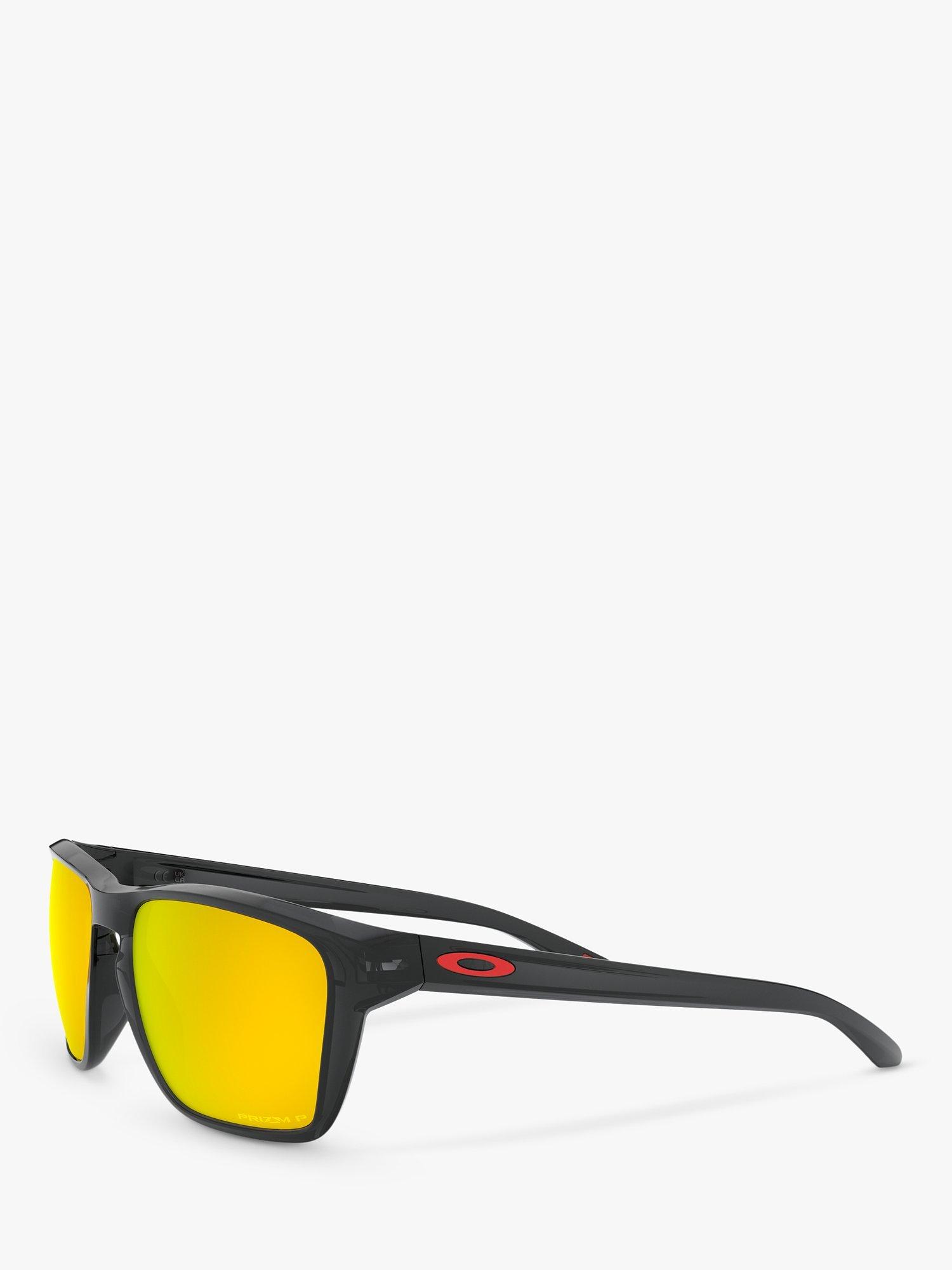 Product image 2 of 8, which shows Oakley OO9448 Men's Sylas Prizm Polarised Rectangular Sunglasses, Black Ink/Mirror Orange