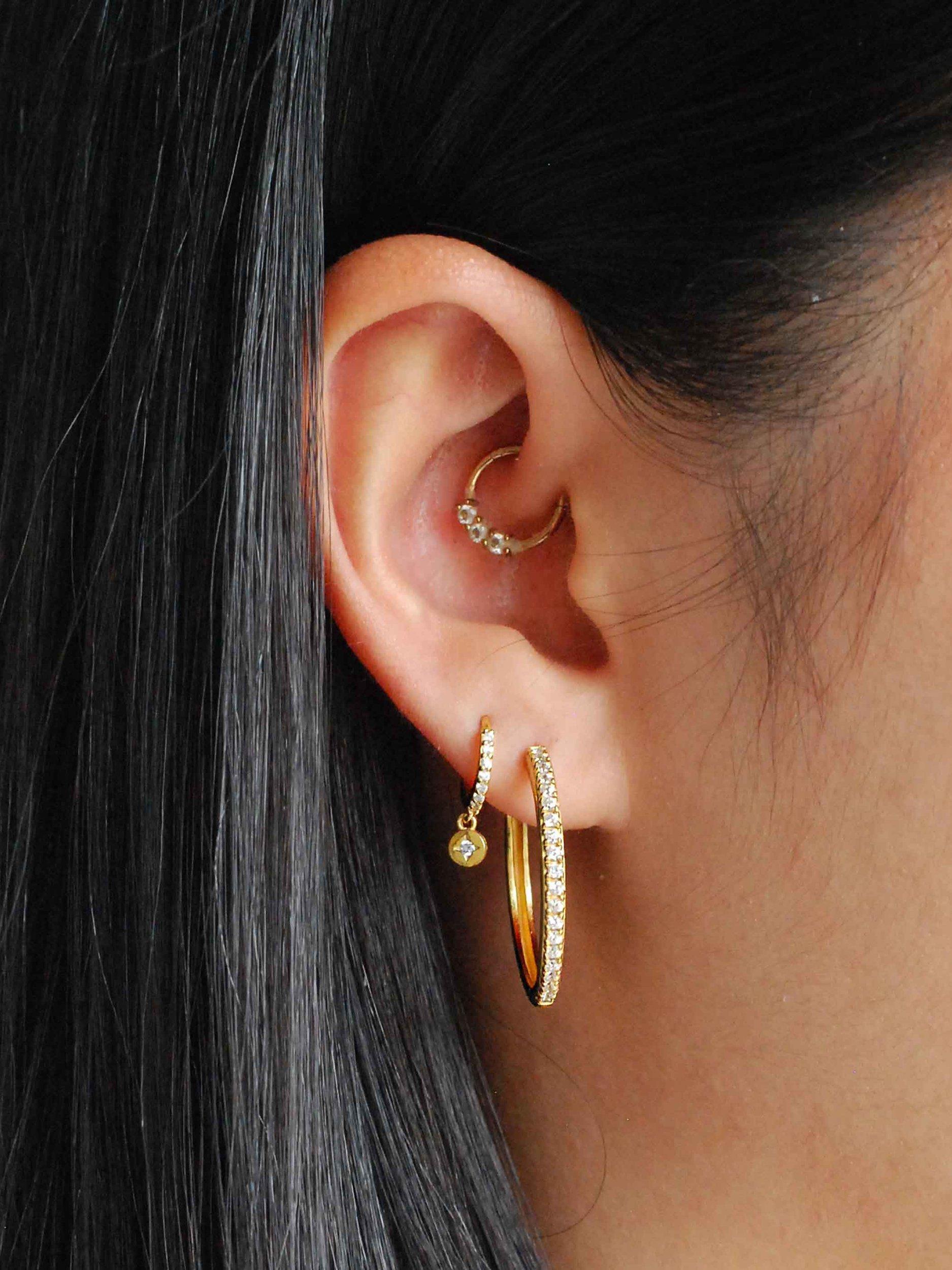 Product image 1 of 2, which shows Astrid & Miyu Crystal Large Hinge Hoop Earrings, Gold/Clear