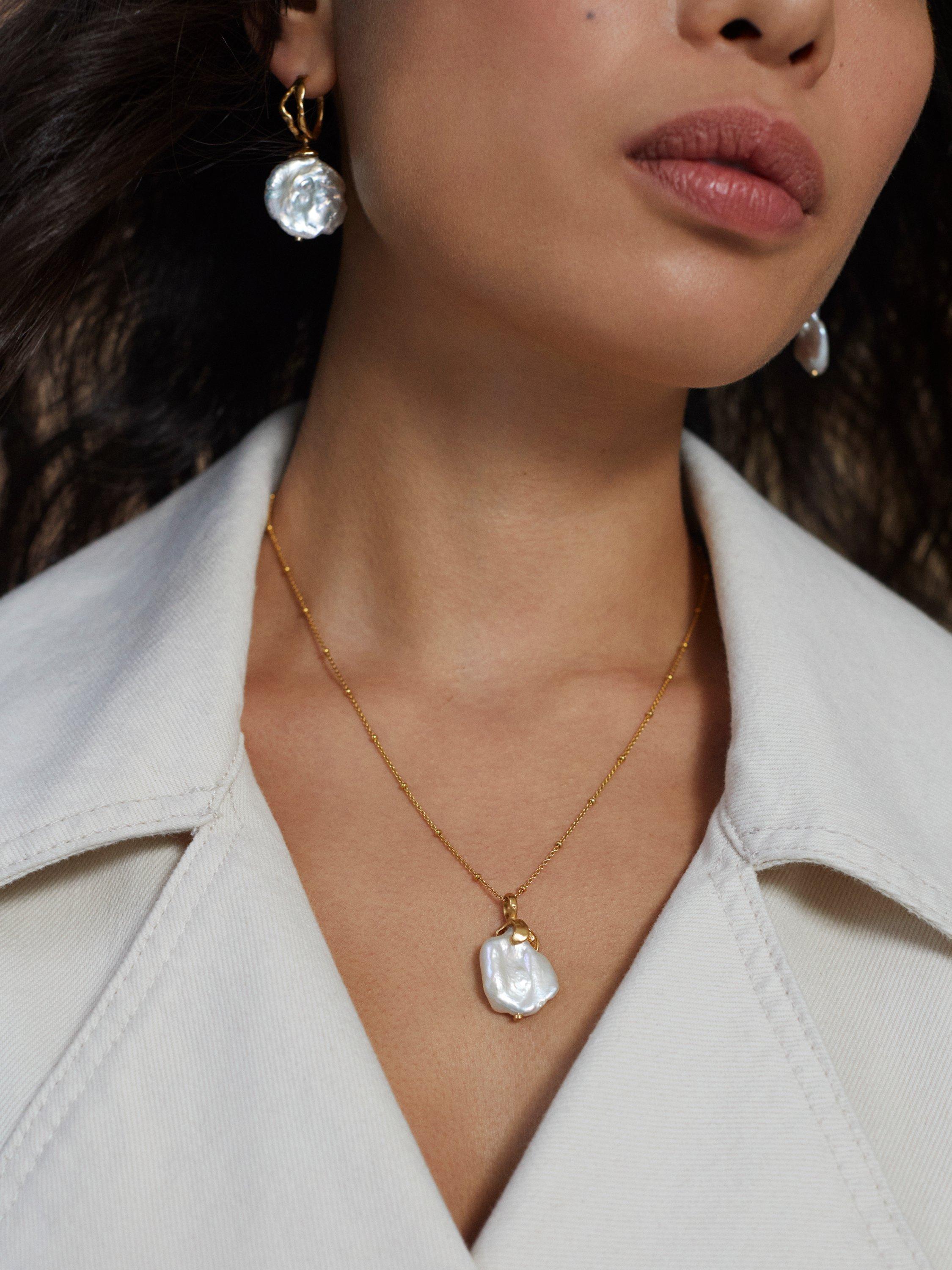 Product image 5 of 6, which shows Monica Vinader x Mother of Pearl Keshi Pearl Large Hoop Earrings, Gold/White