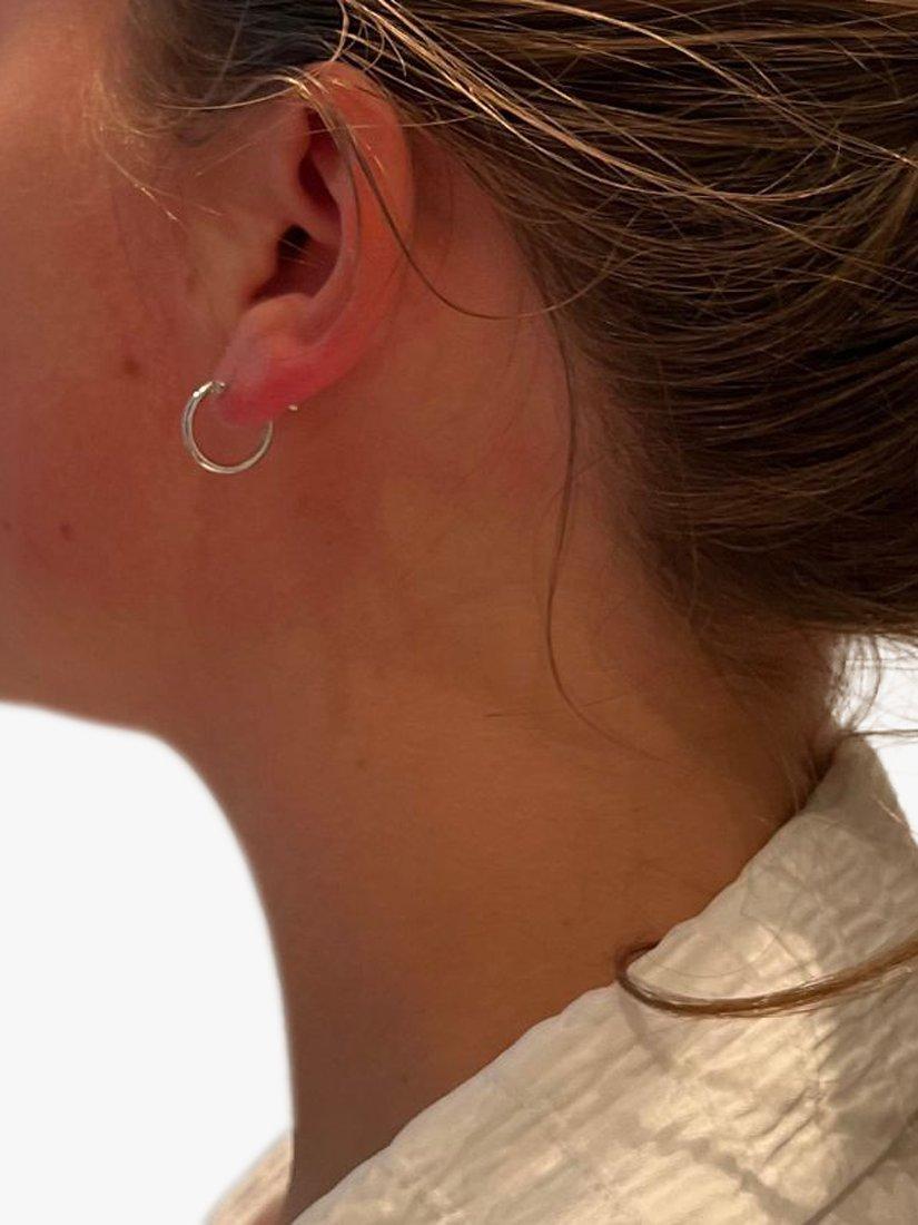 Product image 2 of 4, which shows The Hoop Station Clasica Huggie Hoop Earrings, Silver