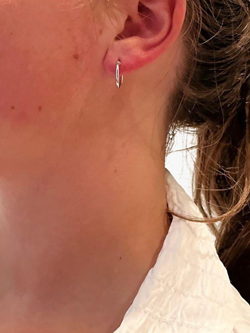 Product image 3 of 4, which shows The Hoop Station Clasica Huggie Hoop Earrings, Silver