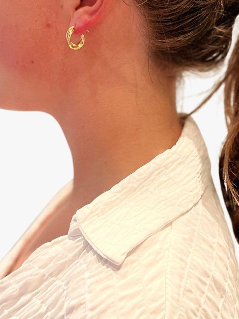 Product image 3 of 4, which shows The Hoop Station Duo Twist Huggie Hoop Earrings, Gold
