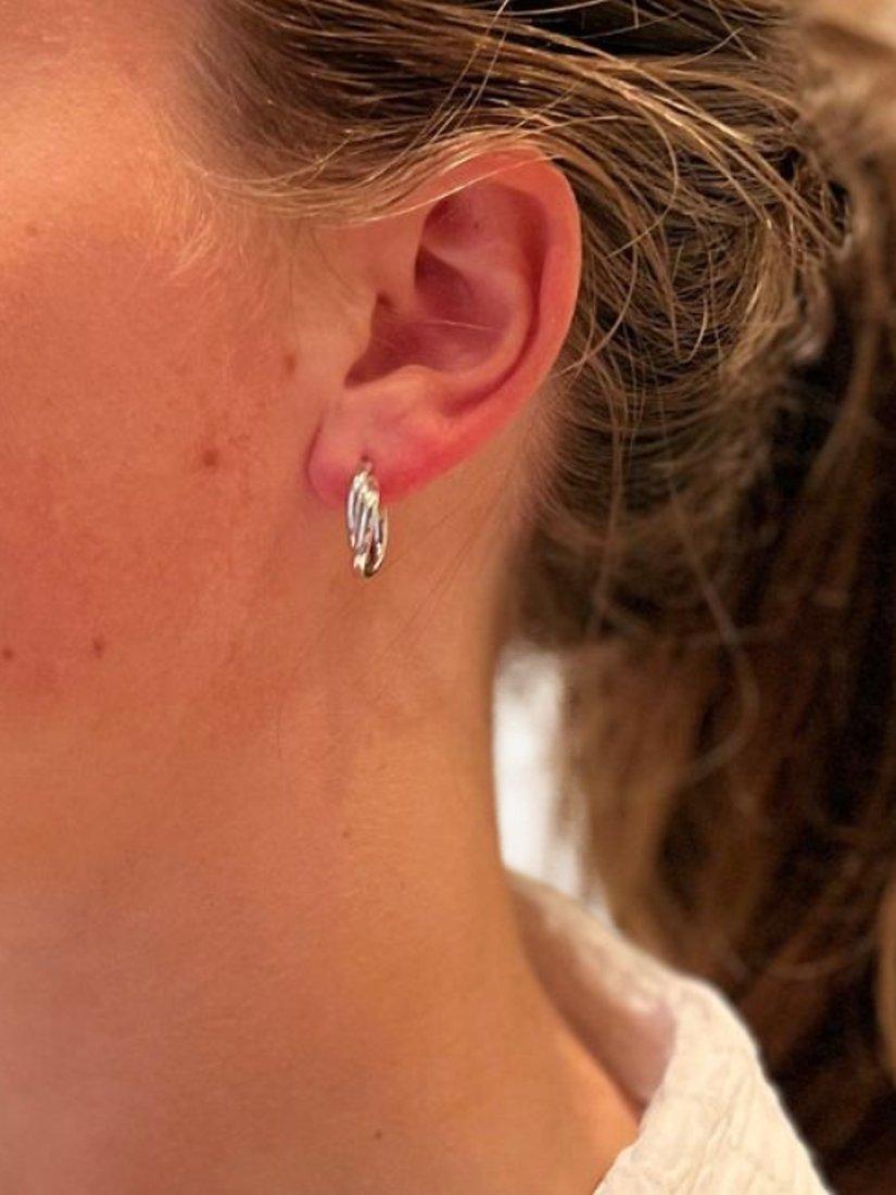 Product image 2 of 4, which shows The Hoop Station Duo Twist Huggie Hoop Earrings, Silver