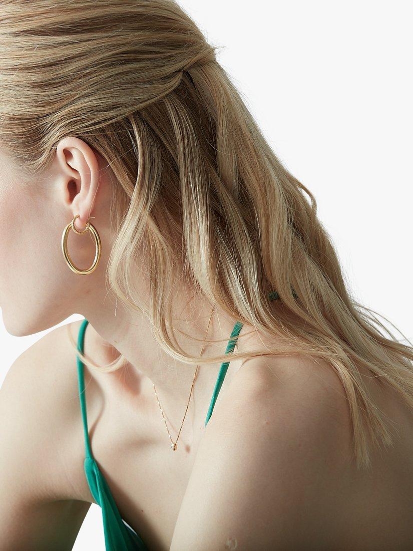 Product image 2 of 3, which shows The Hoop Station Isola Bella Oval Hoop Earrings, Gold
