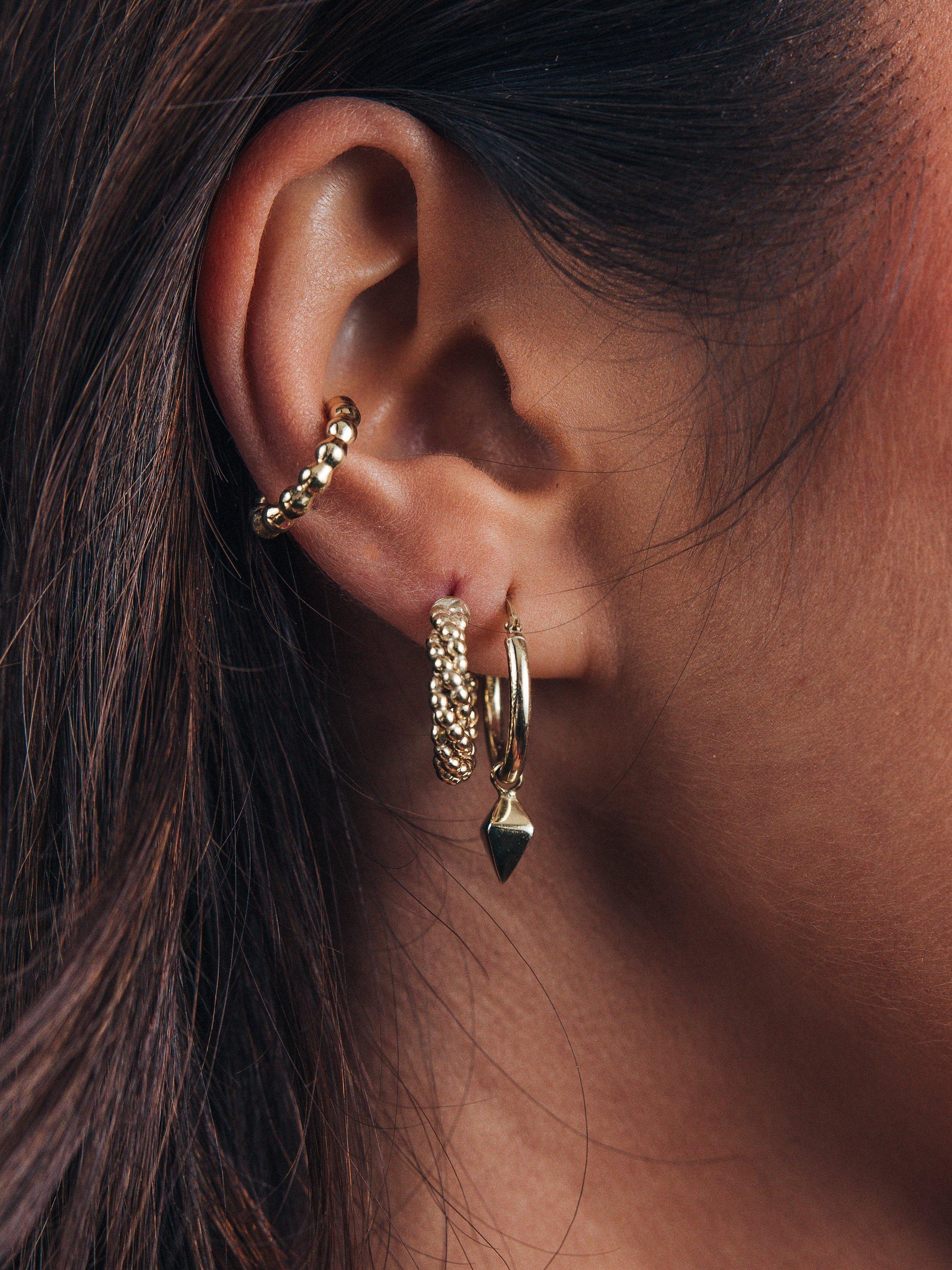 Product image 2 of 5, which shows LARNAUTI Twisted Bead Hoop Earrings, Gold