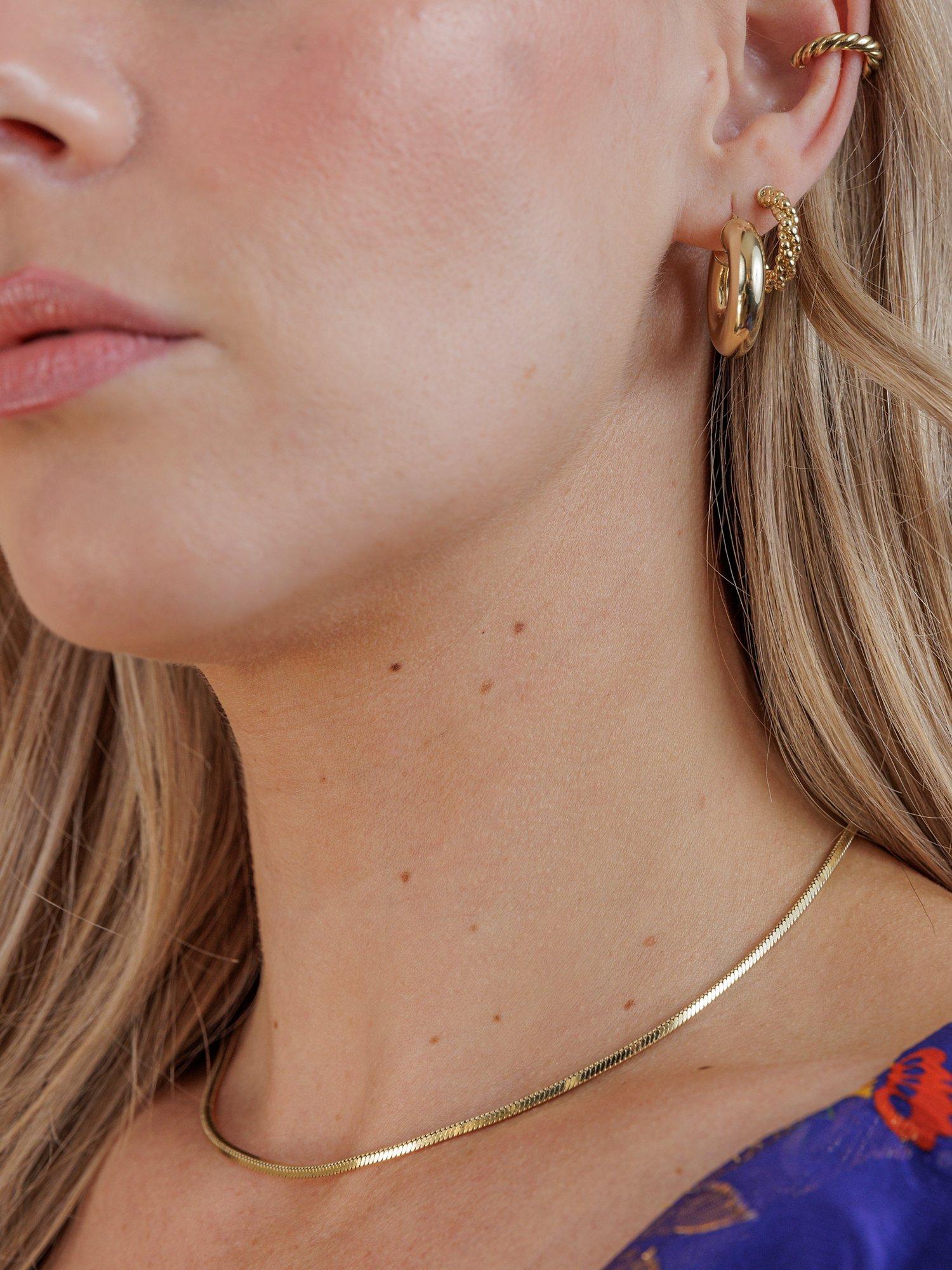 Product image 5 of 5, which shows LARNAUTI Twisted Bead Hoop Earrings, Gold