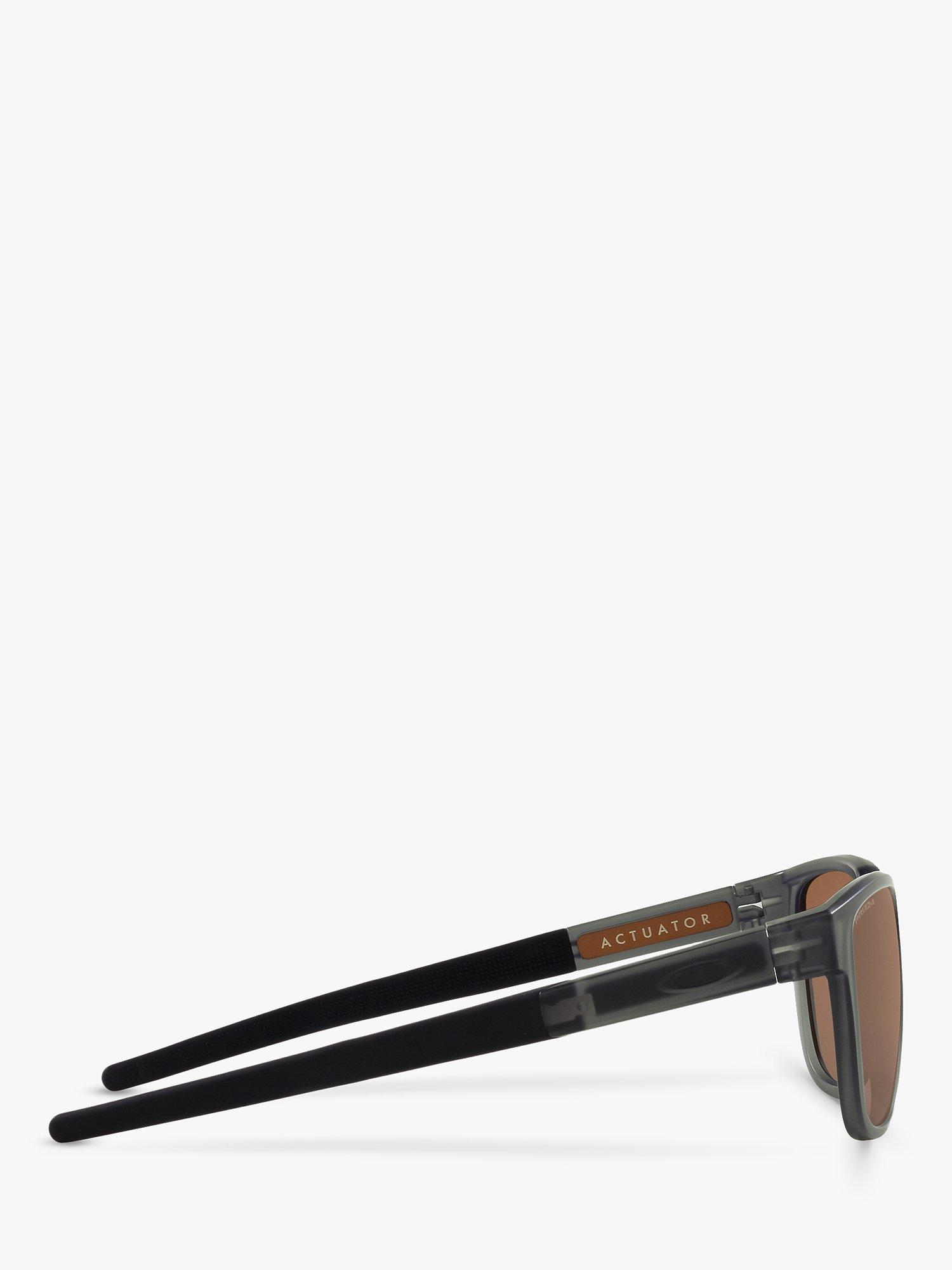 Product image 10 of 11, which shows Oakley OO925 Men's Rectangular Sunglasses, Grey Smoke/Brown