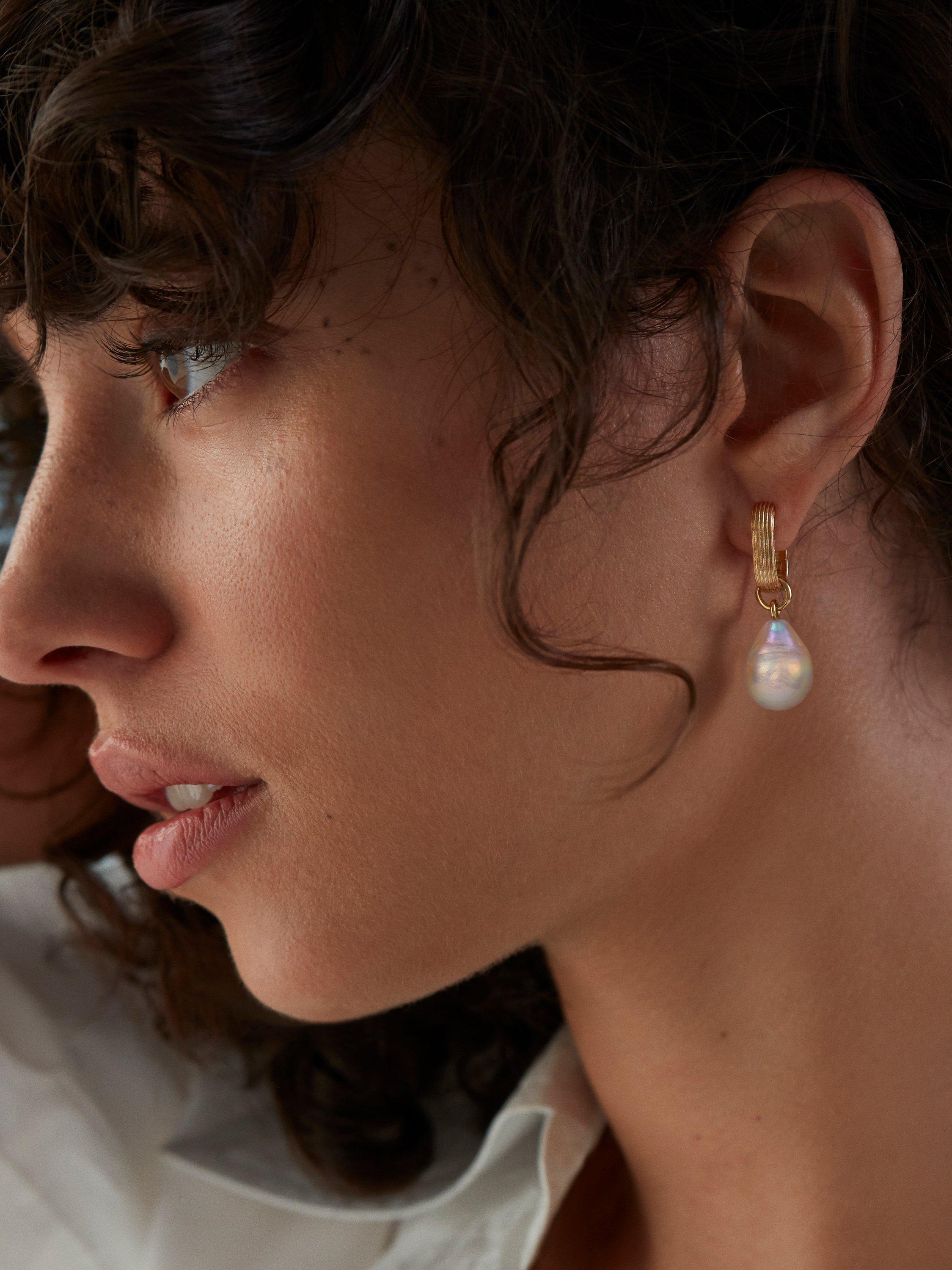 Product image 2 of 6, which shows Monica Vinader Groove Baroque Pearl Huggie Earrings, Gold