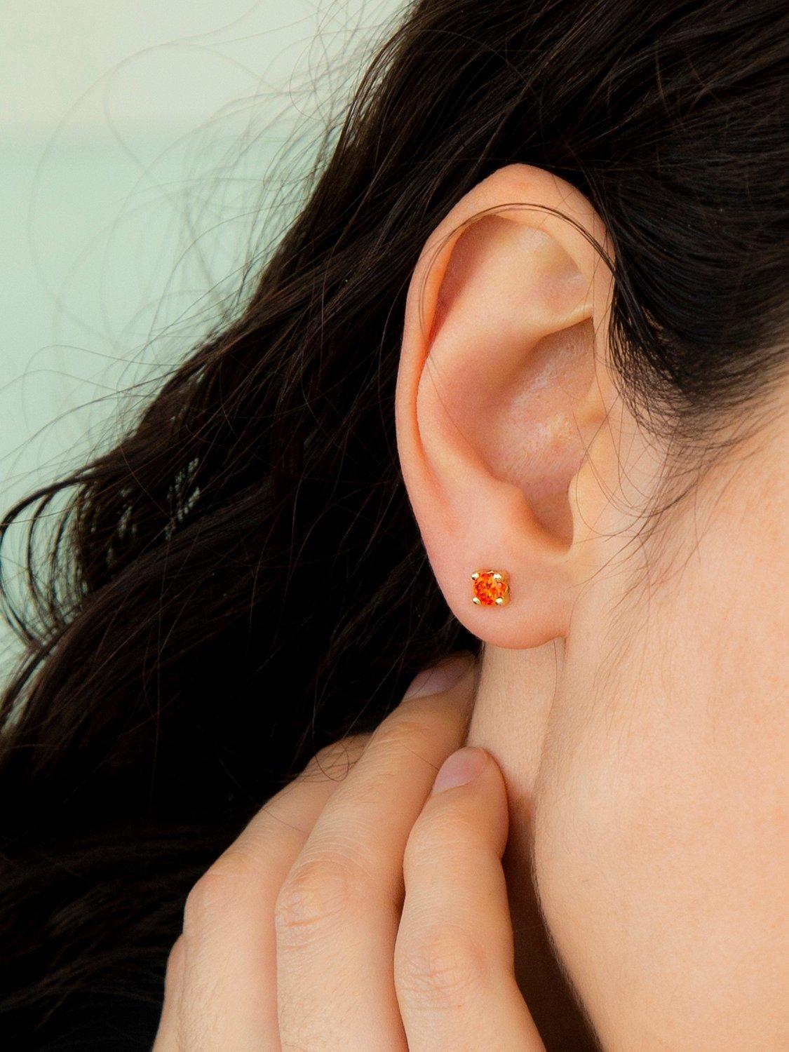 Product image 2 of 4, which shows IBB 9ct Gold Birthday Round Stud Earrings, January/Orange