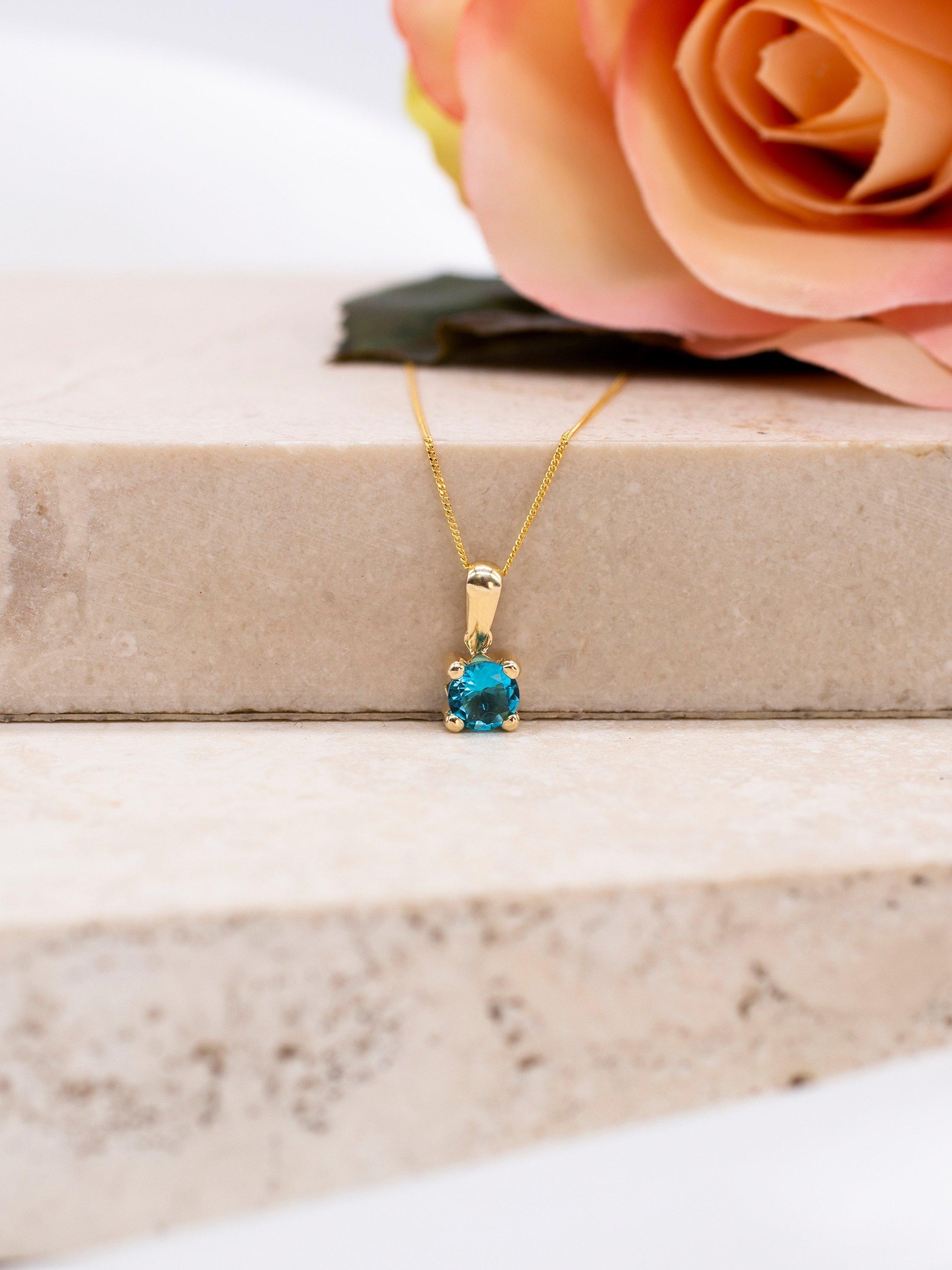 Product image 3 of 4, which shows IBB 9ct Yellow Gold Round Cubic Zirconia Pendant Necklace, December/Topaz Blue