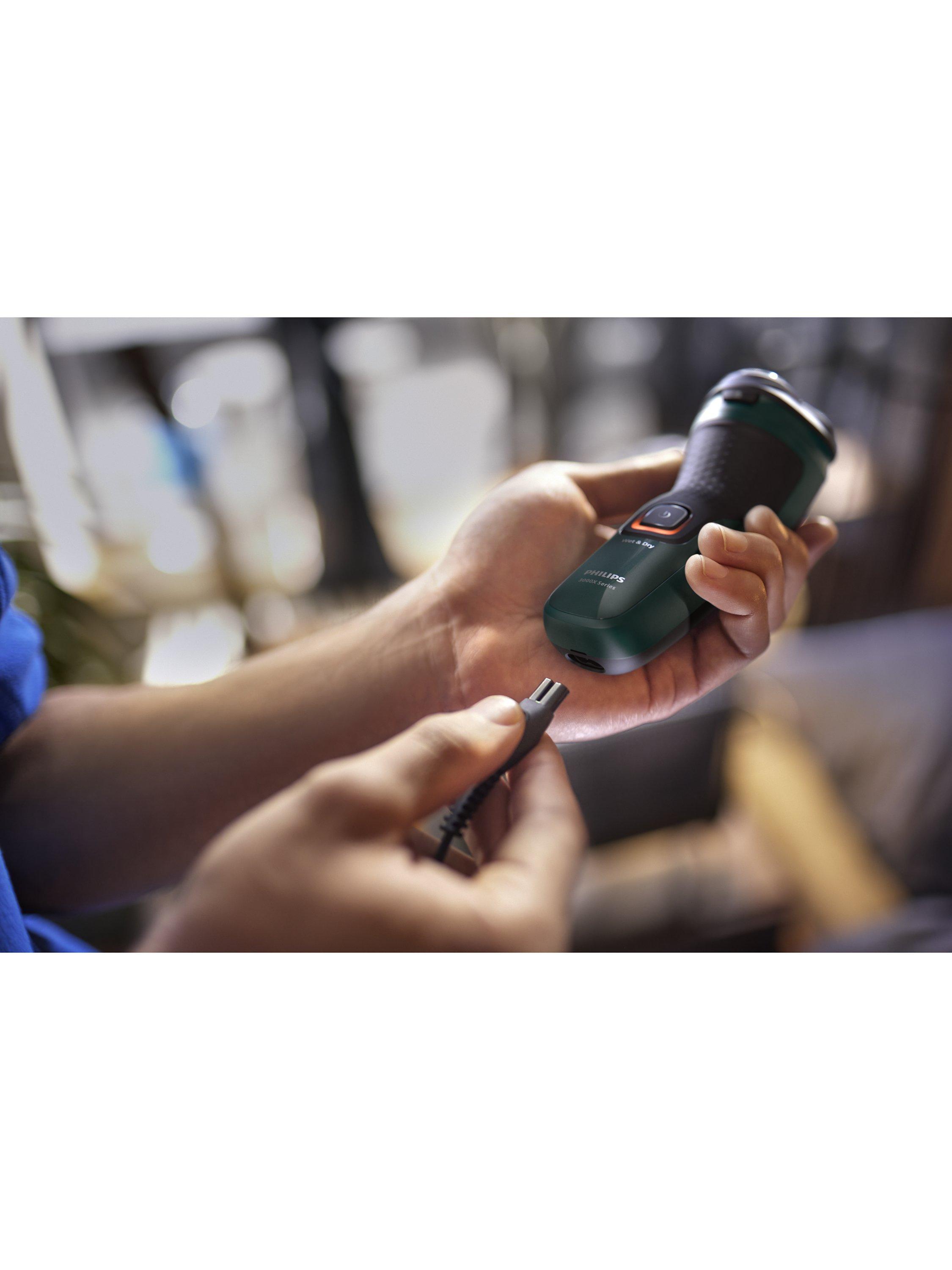 Product image 10 of 12, which shows Philips Series 3000X X3052/00 Wet & Dry Electric Shaver with 27 PowerCut Blades, 4D Flex Heads & Pop-up Trimmer, Dark Green Forest