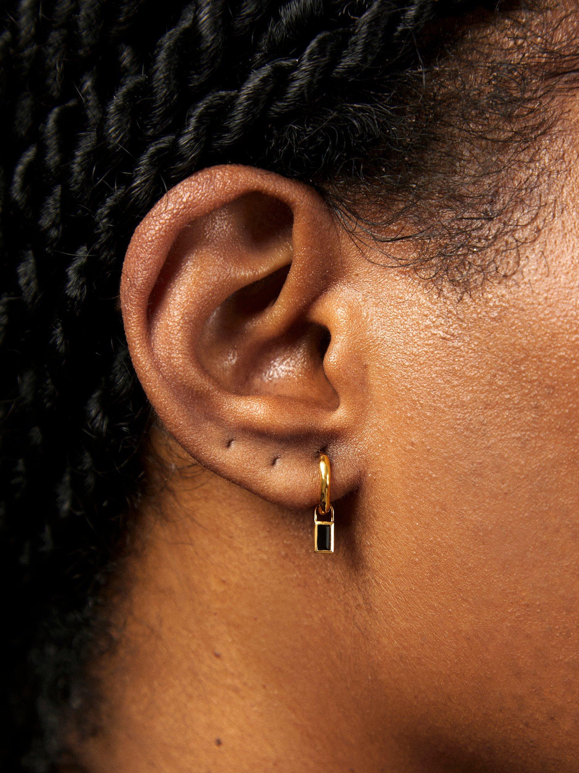 Product image 2 of 4, which shows Monica Vinader Siren Muse Black Spinel Baguette Gemstone Mini Huggie Earrings, Gold
