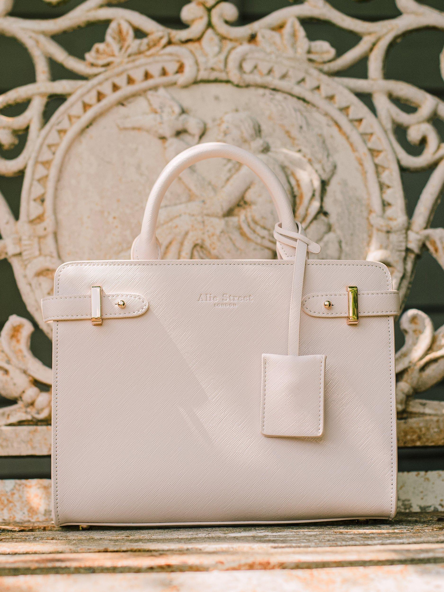 Product image 4 of 9, which shows Alie Street Derby Handbag, Nude