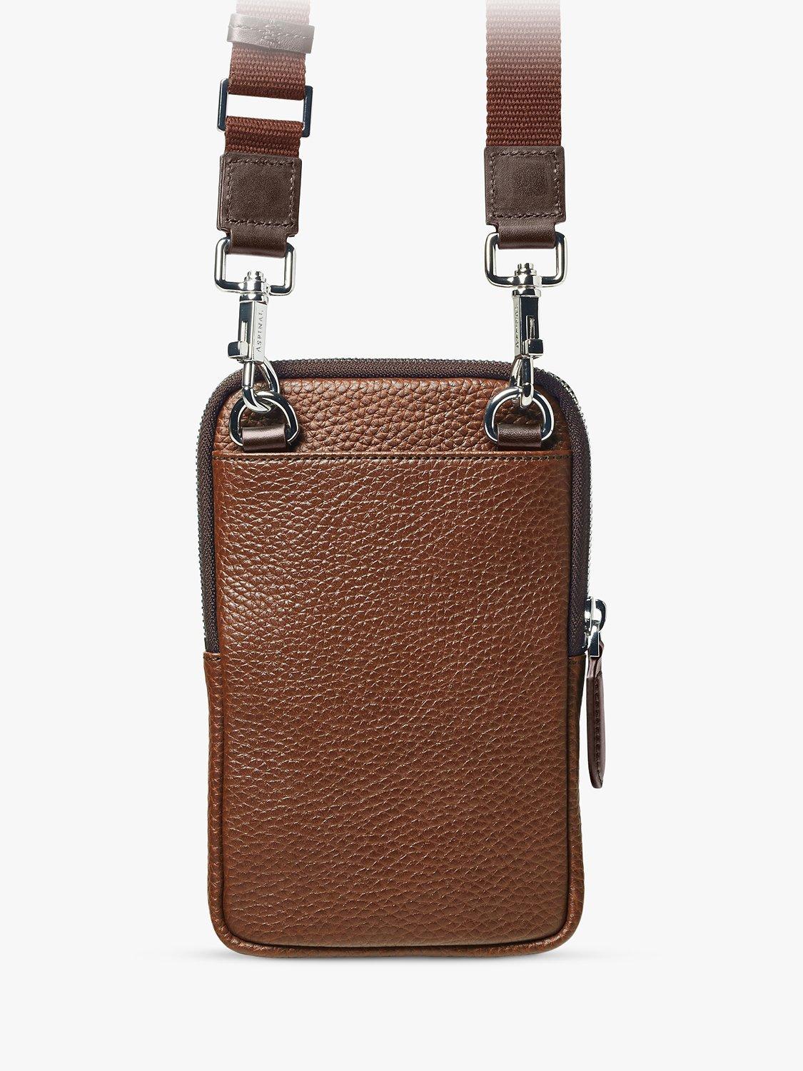 Product image 2 of 6, which shows Aspinal of London Reporter Pebble Leather Crossbody Phone Bag, Tobacco