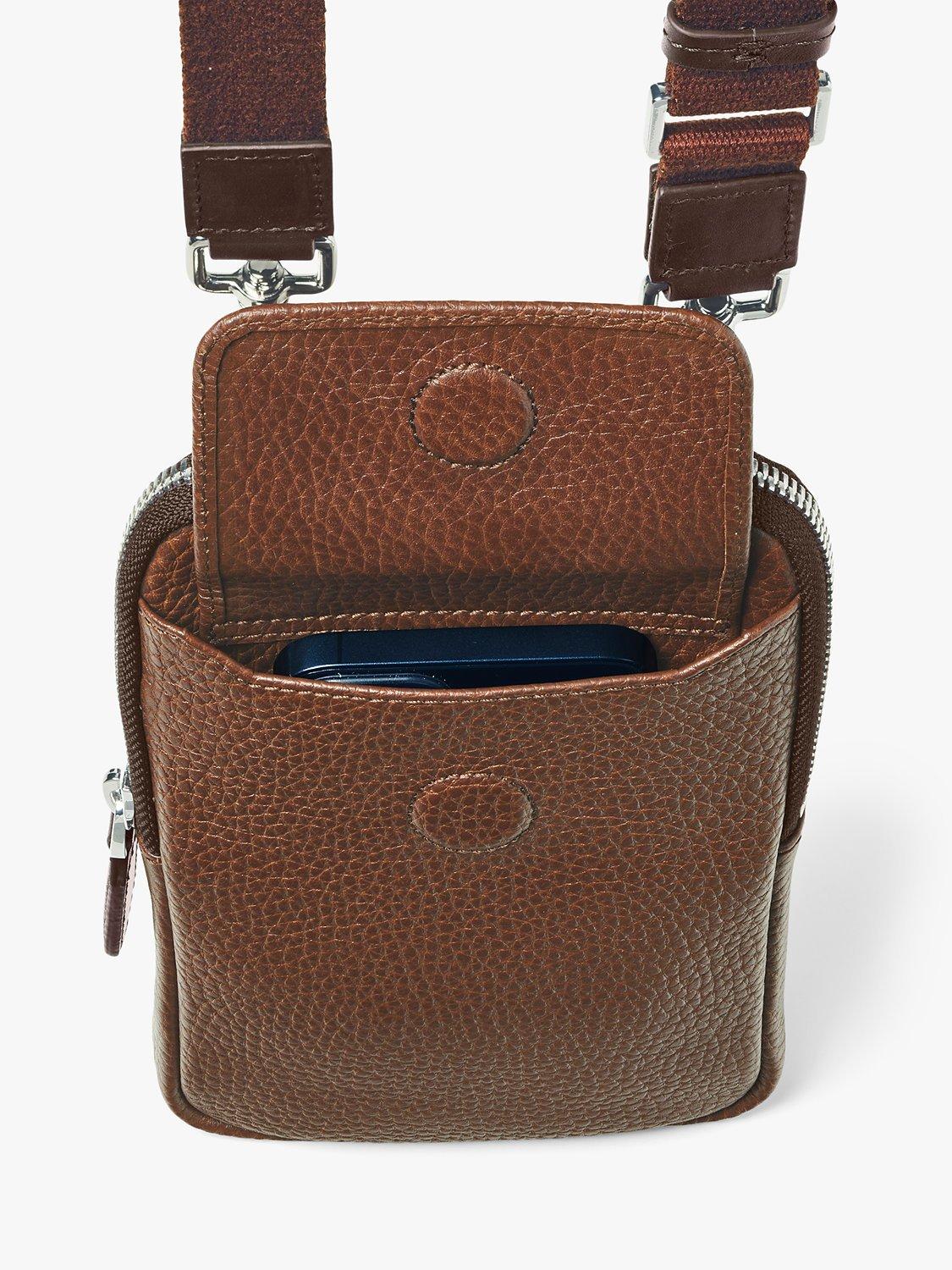 Product image 6 of 6, which shows Aspinal of London Reporter Pebble Leather Crossbody Phone Bag, Tobacco