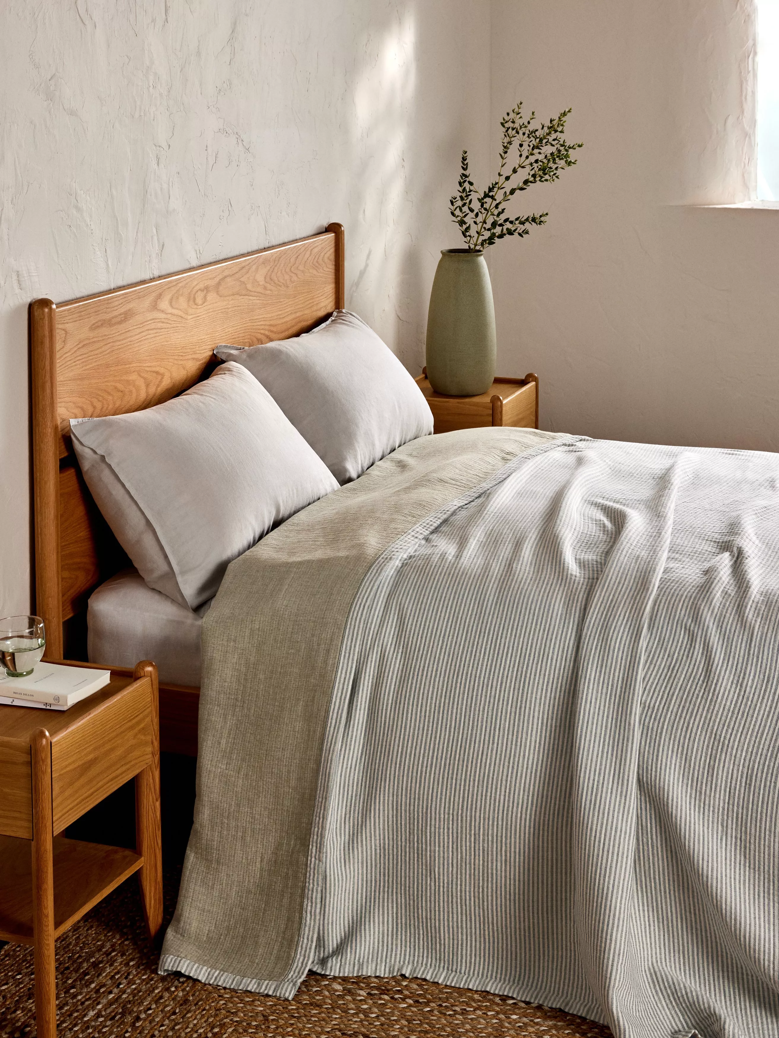 multi coloured check bedspread on a bed
