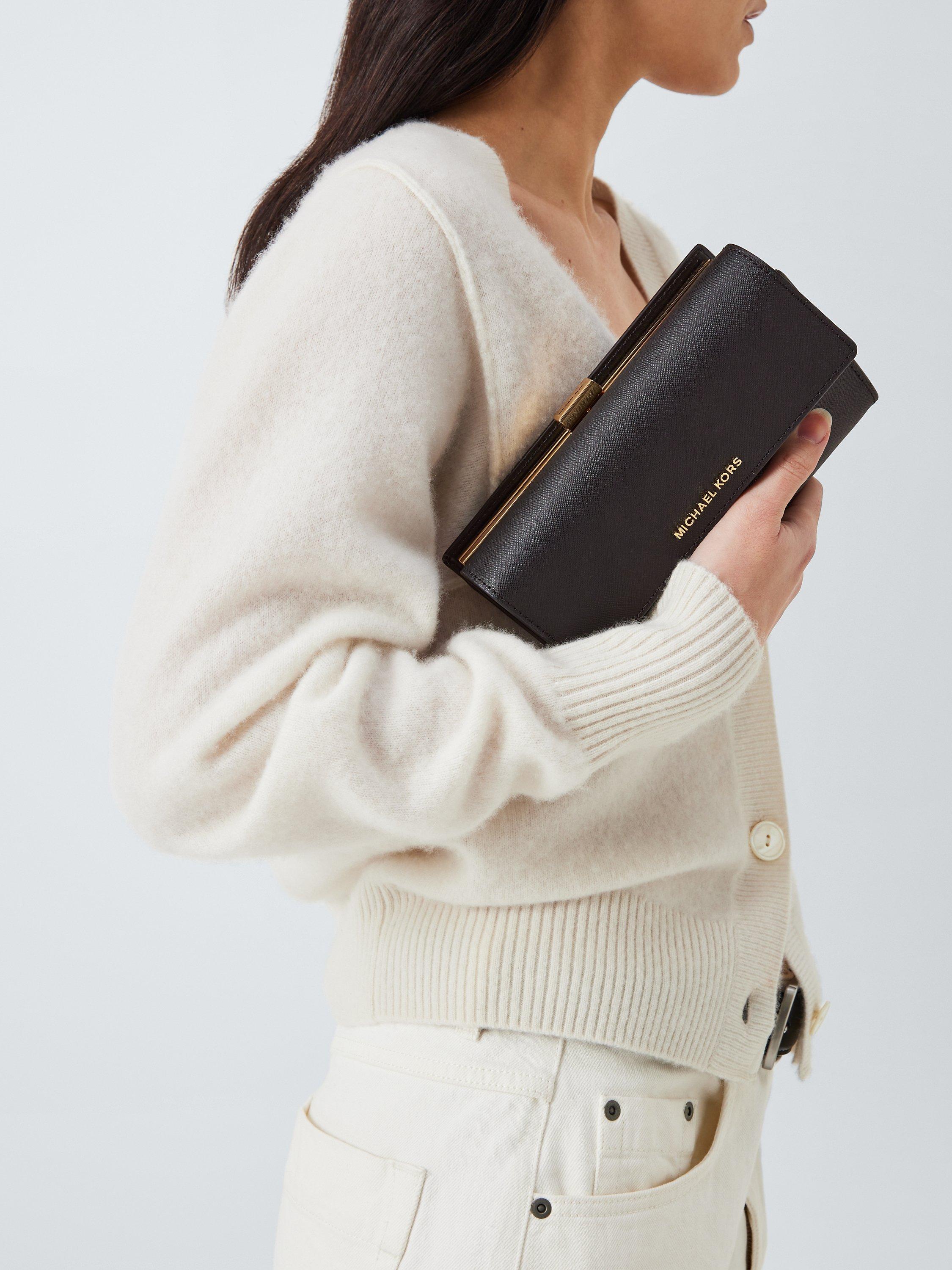 Product image 2 of 6, which shows Michael Kors Jet Set Leather Clutch Bag, Black
