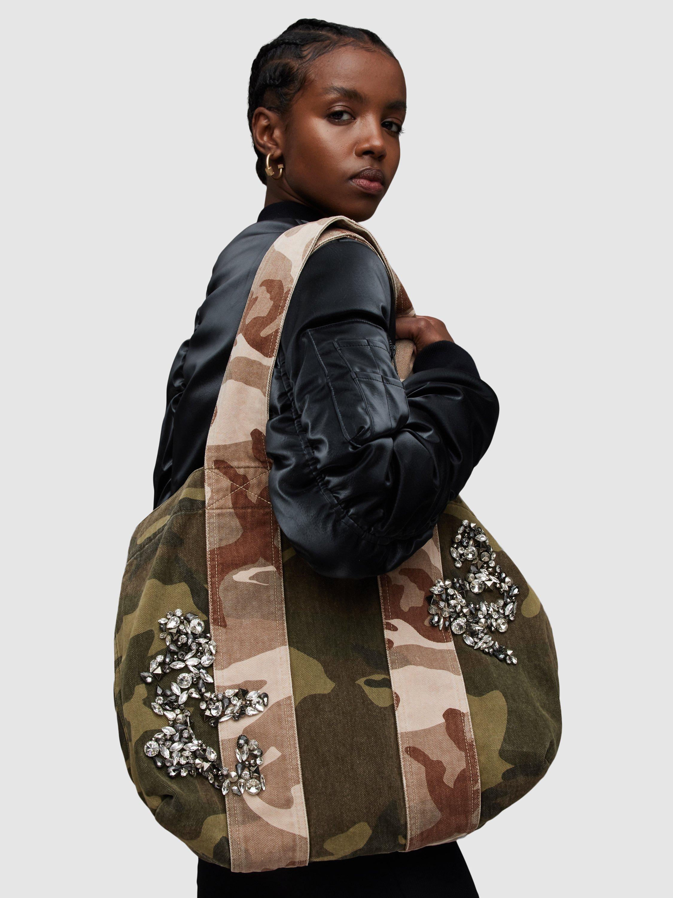 Product image 6 of 6, which shows AllSaints Airi Denim Camo Embellished Tote Bag, Multi