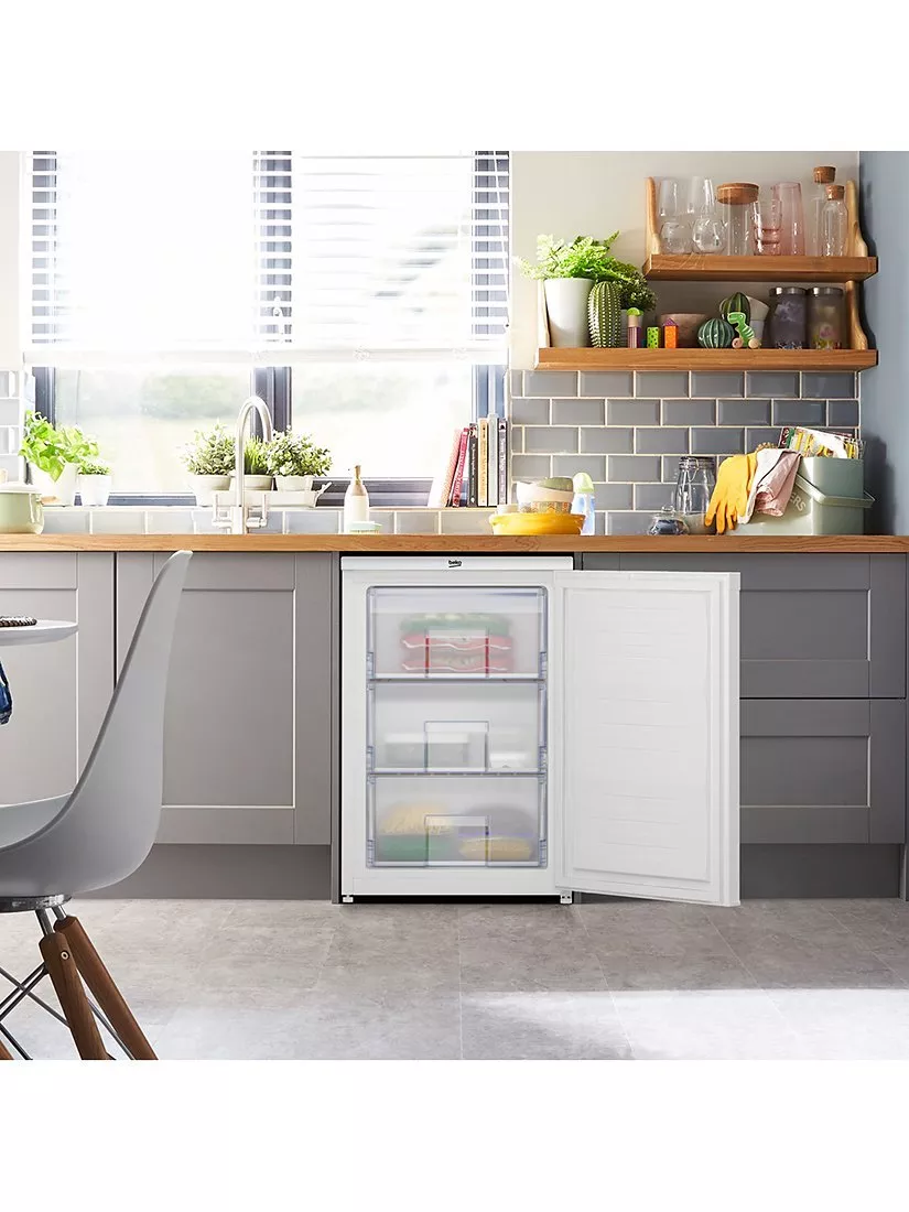Bosch white upright freezer with open door, NoFrost interior shelves and BigBox drawer for frozen food storage