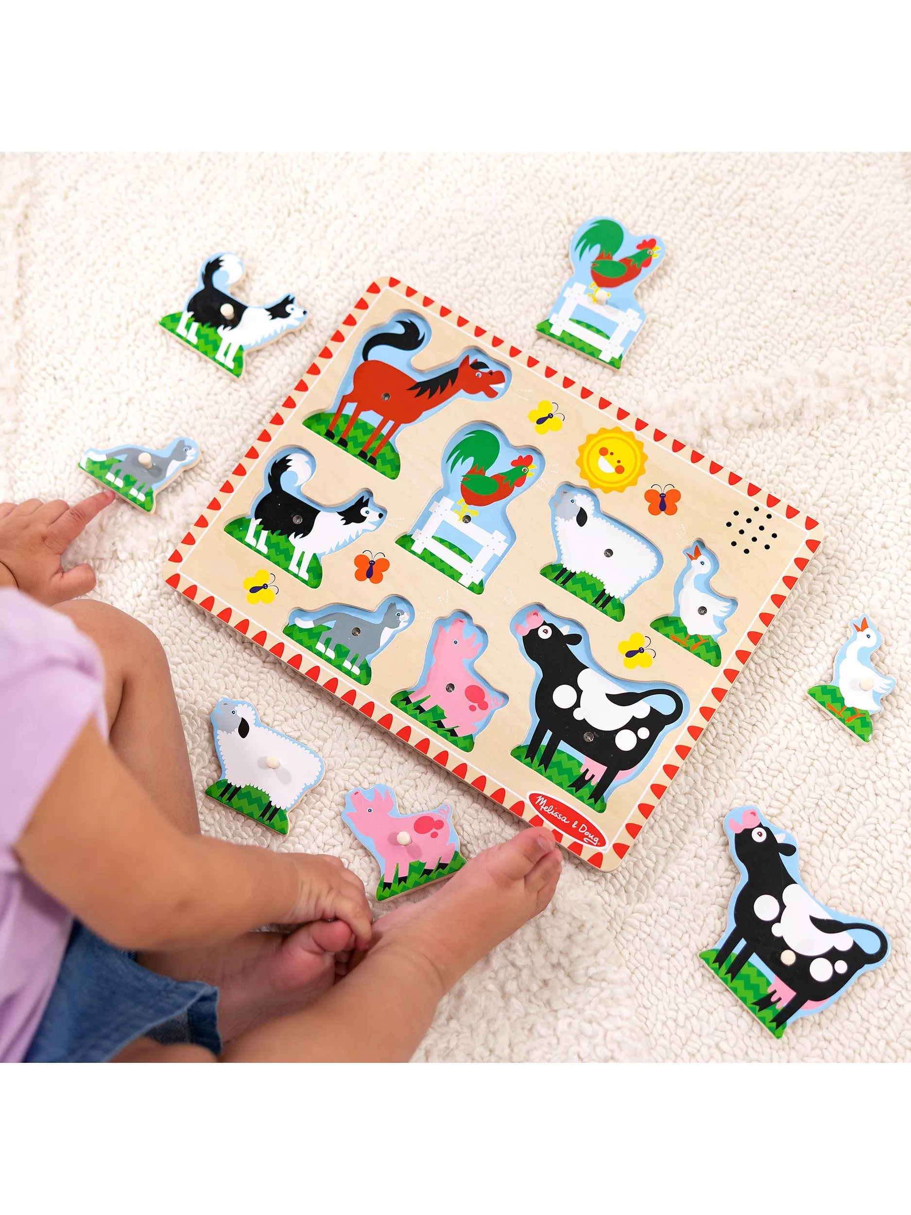 Toddler playing with a wooden puzzle
