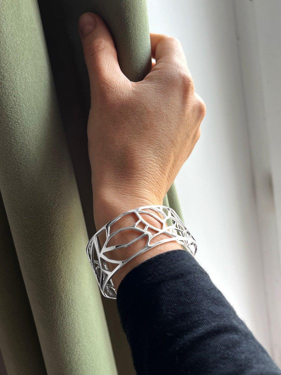 Product image 2 of 6, which shows Nina B Cut Out Design Open Cuff Bangle, Silver
