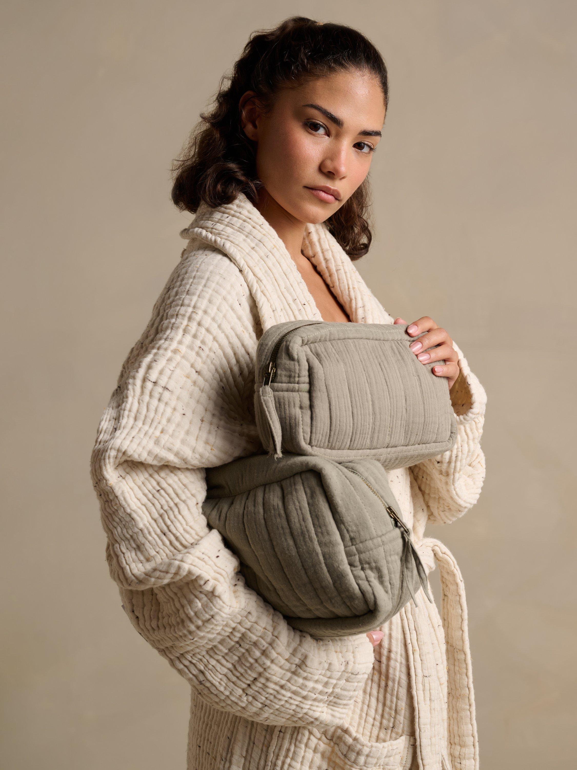 Product image 1 of 7, which shows Bedfolk Dream Cotton Wash Bag, Moss