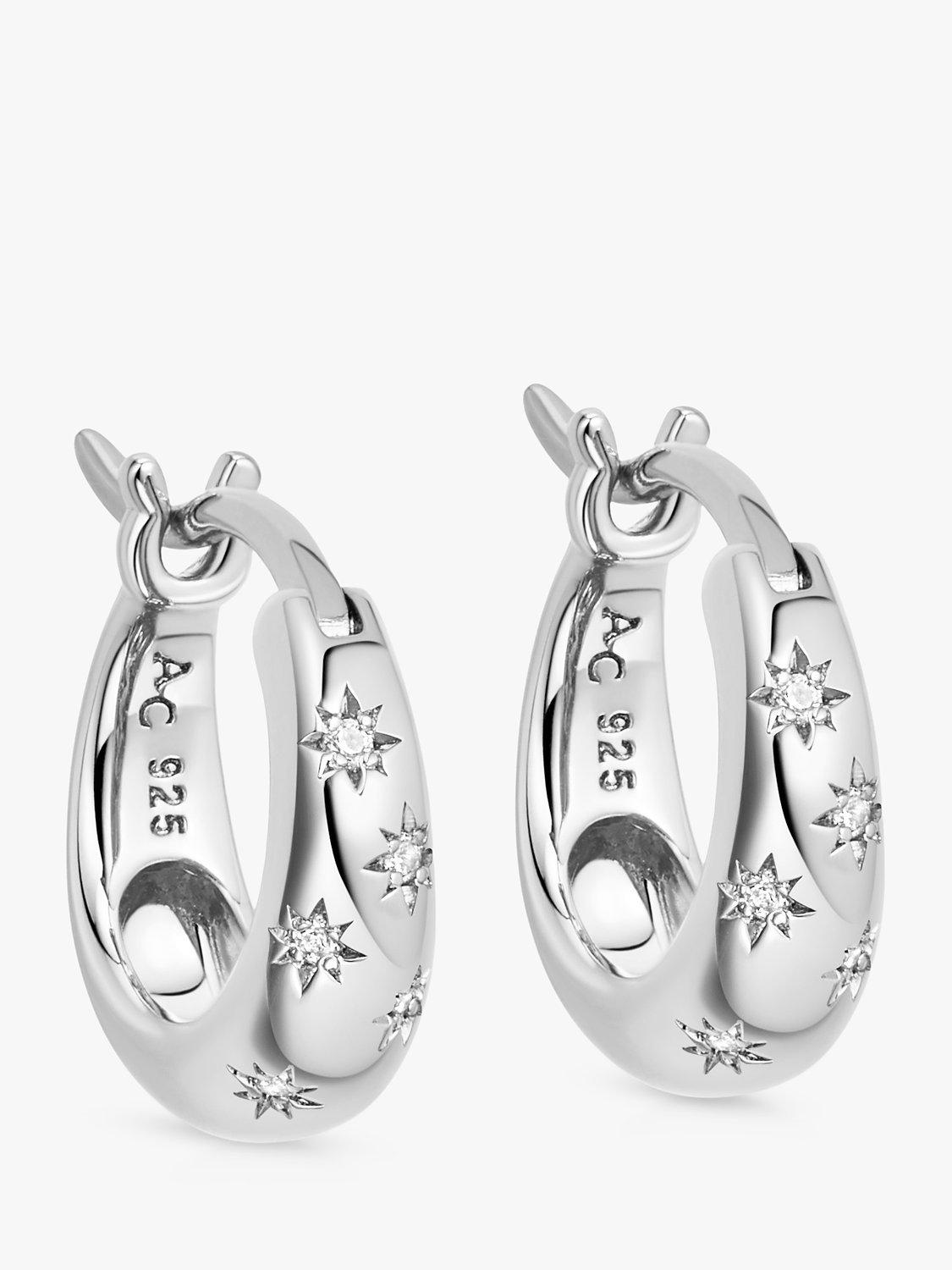 Product image 1 of 2, which shows Astley Clarke Celestial North Star White Sapphire Huggie Hoop Earrings, Silver