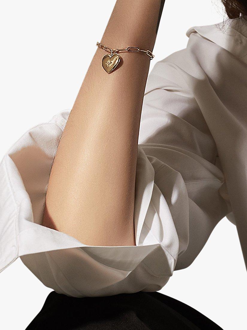 Product image 2 of 4, which shows Wanderlust + Co Heart Locket Chain Bracelet, Gold
