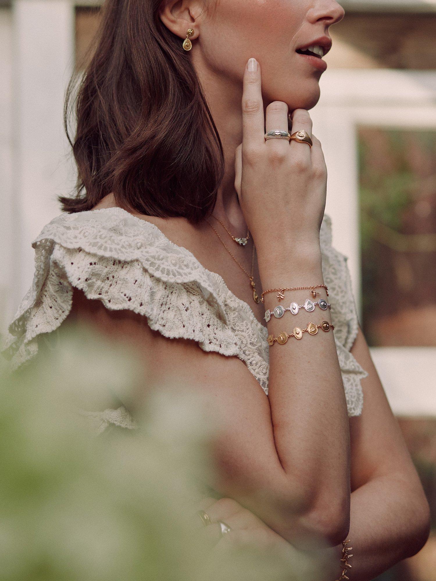 Product image 2 of 4, which shows Alex Monroe Senses Token Charm Bracelet, Gold