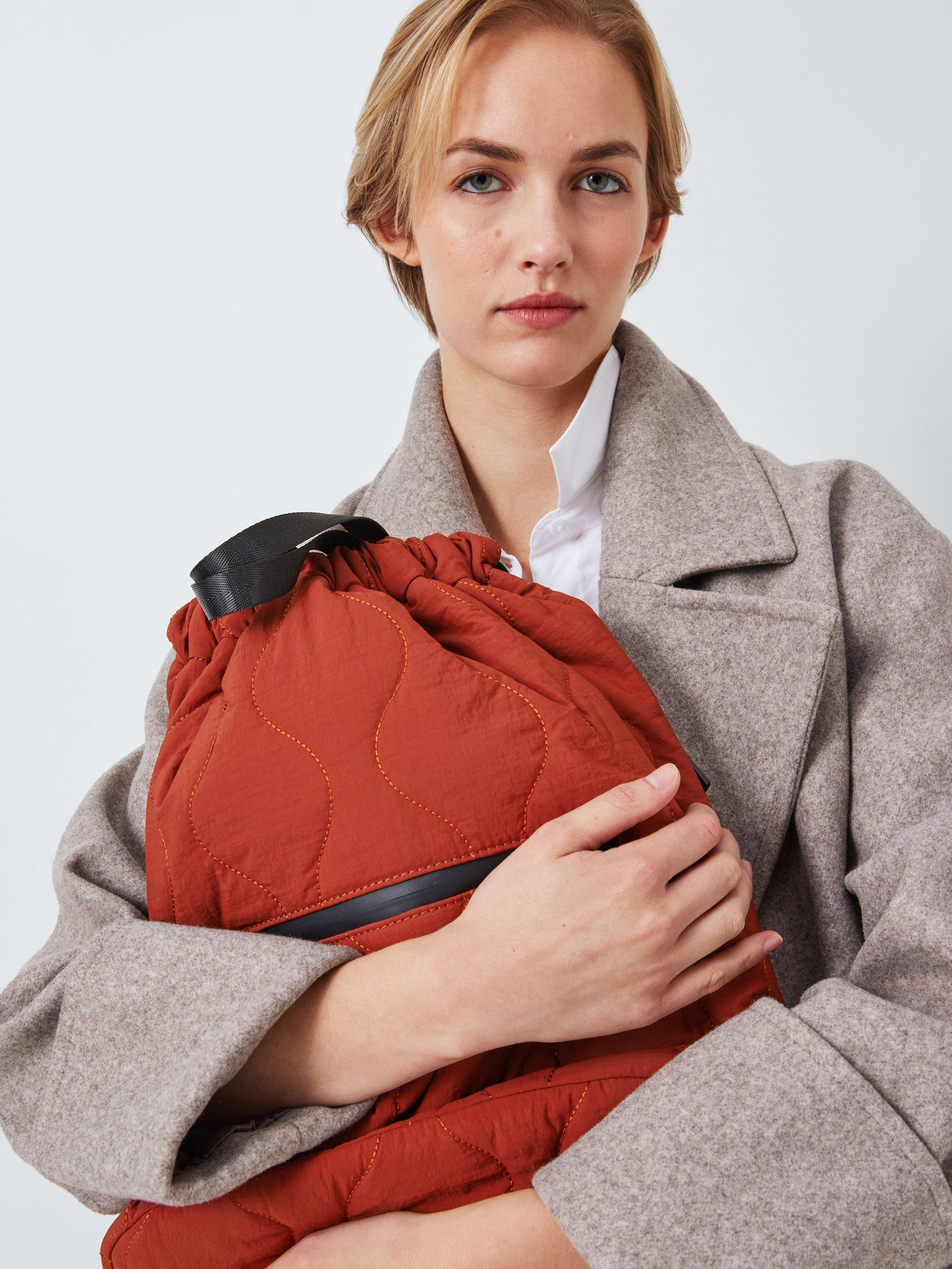 Product image 2 of 6, which shows John Lewis ANYDAY Quilted Drawstring Backpack, Brown