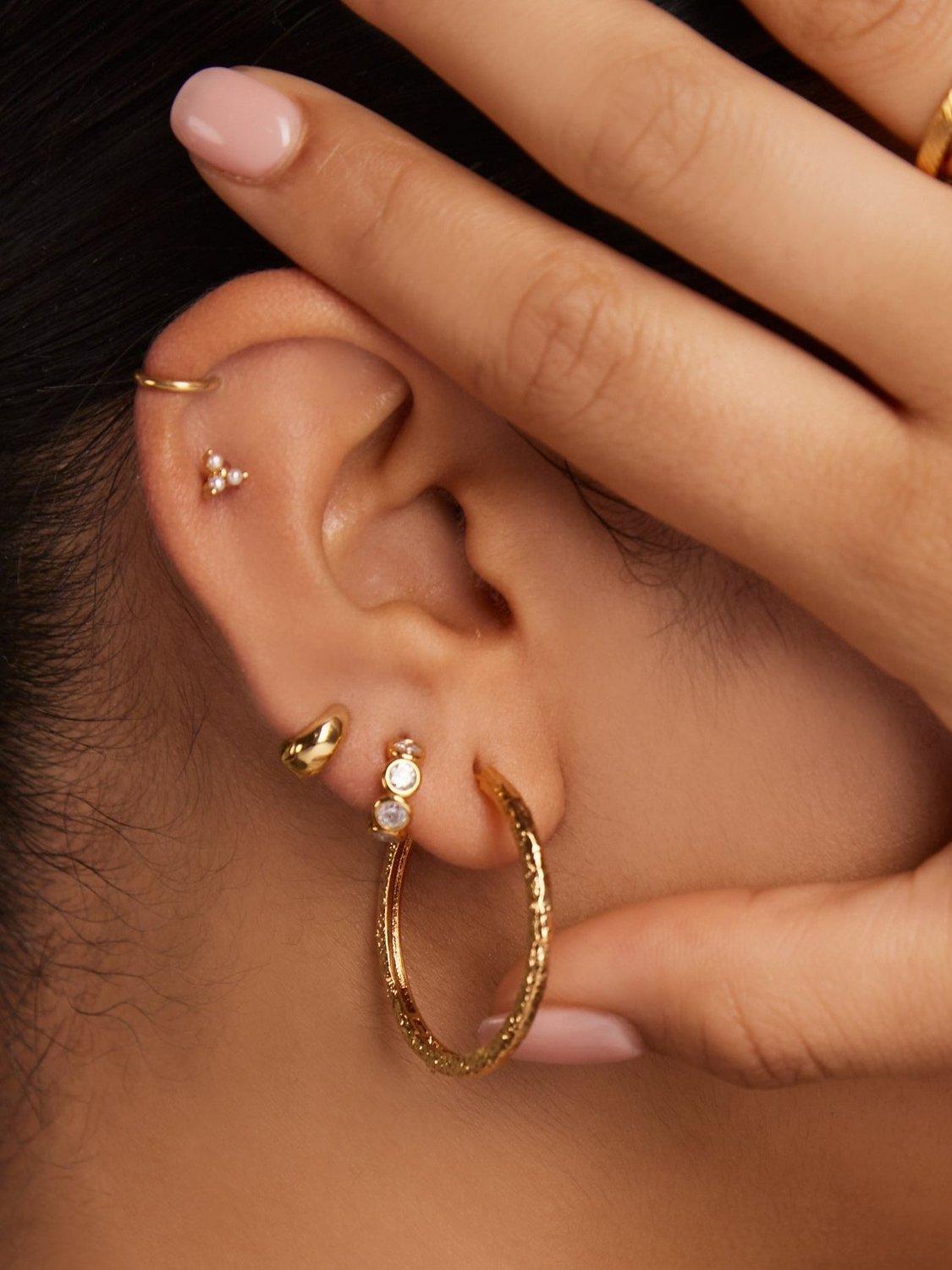 Product image 2 of 2, which shows Orelia Molten Mid Size Hoop Earrings, Gold