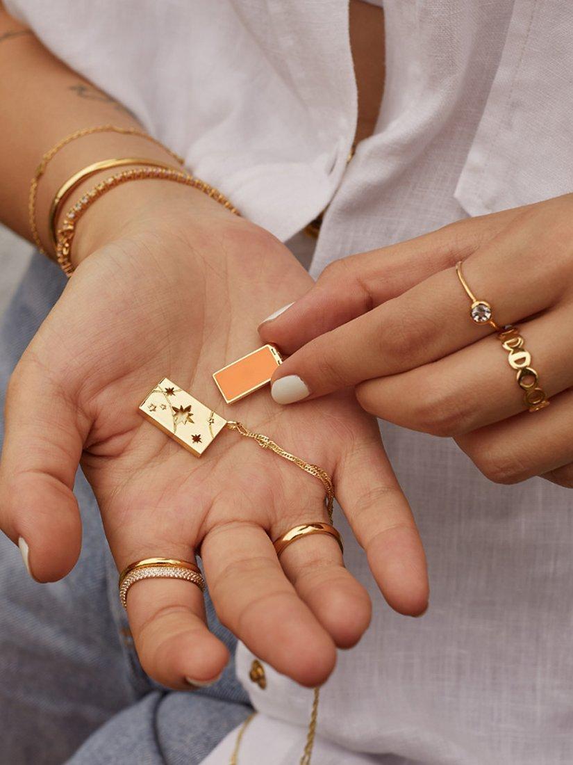 Product image 6 of 10, which shows Wanderlust + Co Red Packet Pendant Necklace, Gold