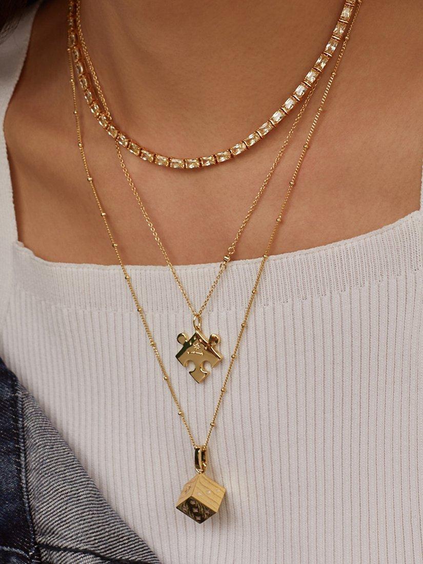 Product image 4 of 8, which shows Wanderlust + Co Puzzle Piece Pendant Necklace, Gold